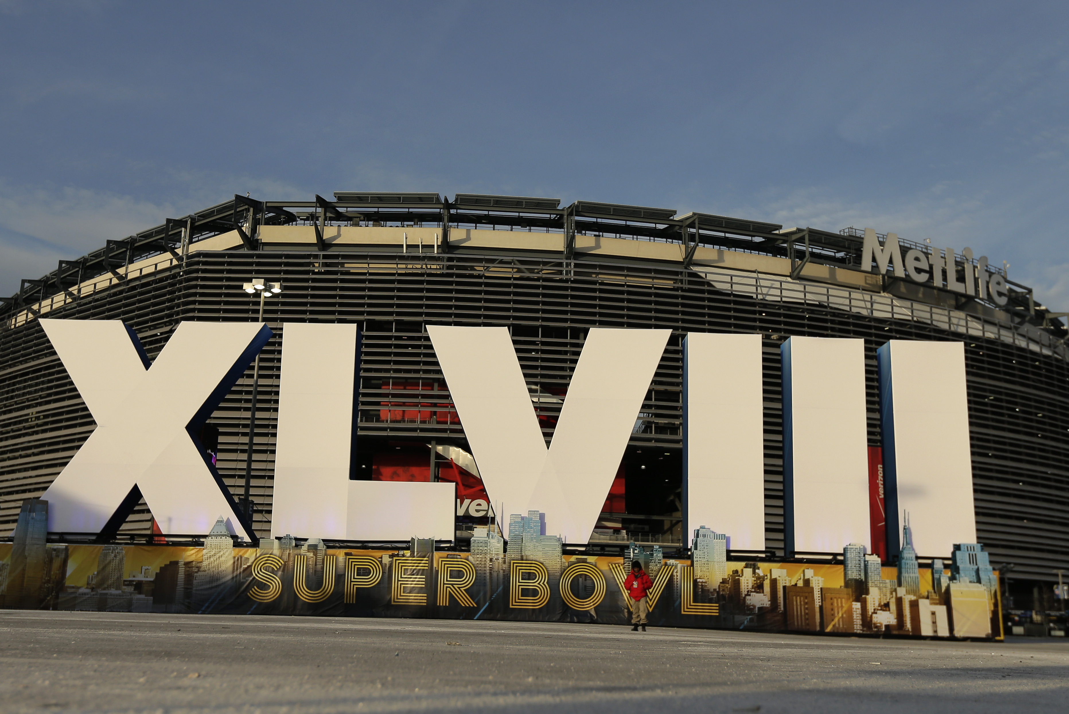 A sign for NFL football's Super Bowl XLVIII stands in front of MetLife Stadium Sat. Feb. 1, 2014, in East Ruthoford, N.J. The stadium will be the site of Sunday's championship game between the Denver Broncos and the Seattle Seahawks. (AP Photo/Charlie Riedel)