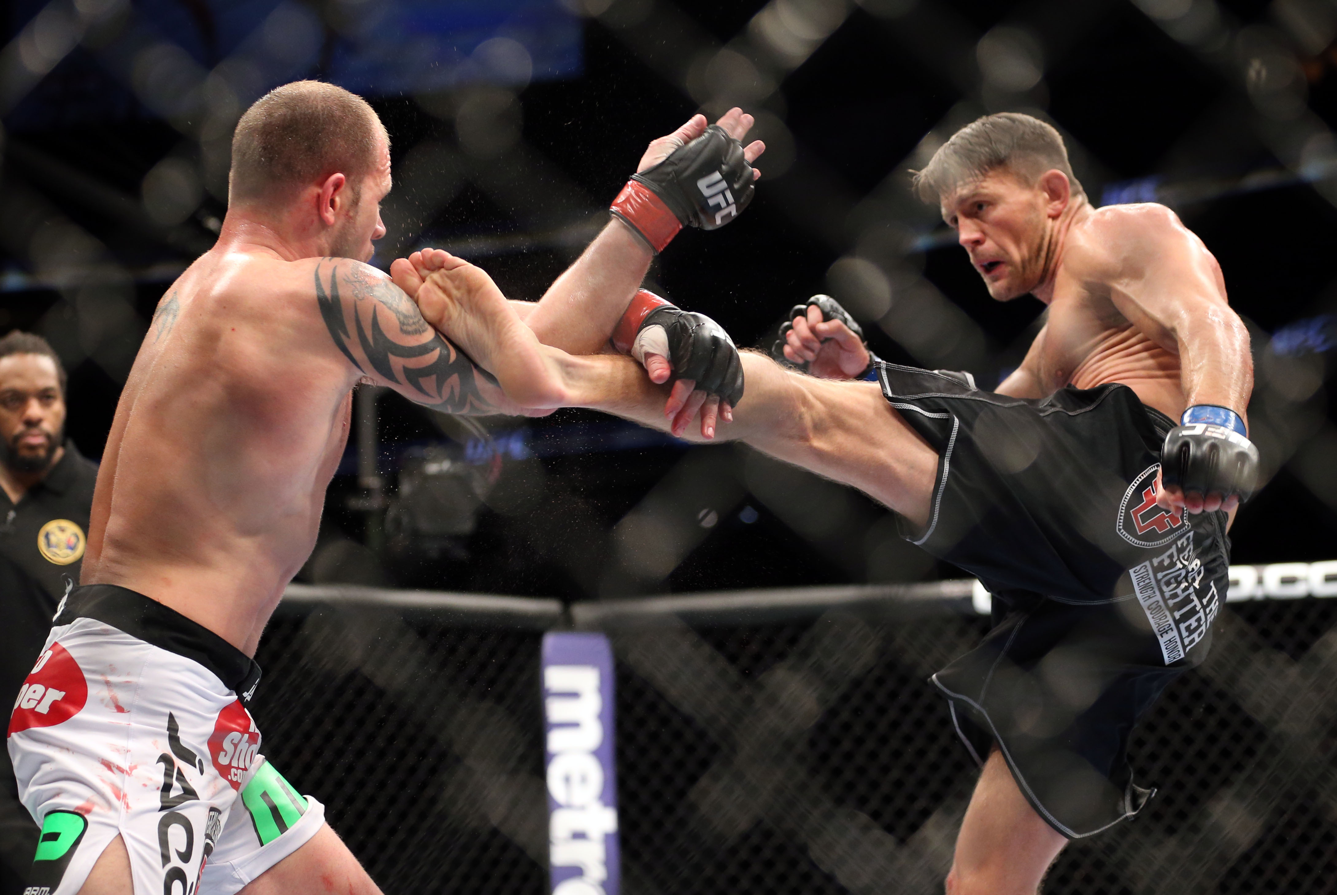 Feb 1, 2014; Newark, NJ, USA; Nick Catone (red gloves) fights Tom Watson (blue gloves) during UFC 169 at Prudential Center. Mandatory Credit: Joe Camporeale-USA TODAY Sports