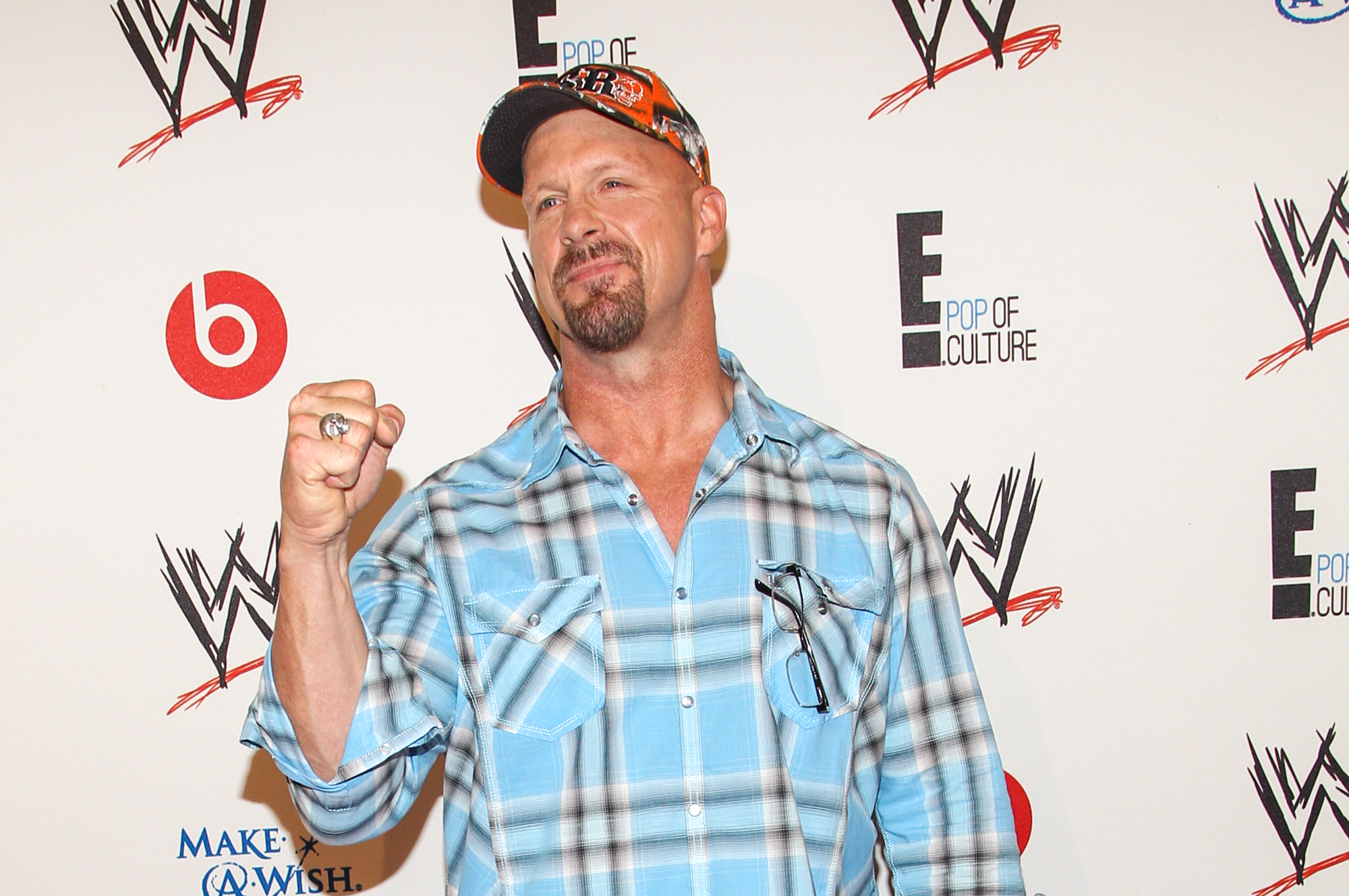WWE Superstar Stone Cold Steve Austin arrives at the Superstars of Hope honors Make A Wish Foundation event at The Beverly Hills Hotel on Thursday, August 15, 2013 in Beverly Hills, Calif. (Photo by Paul A. Hebert/Invision/AP)