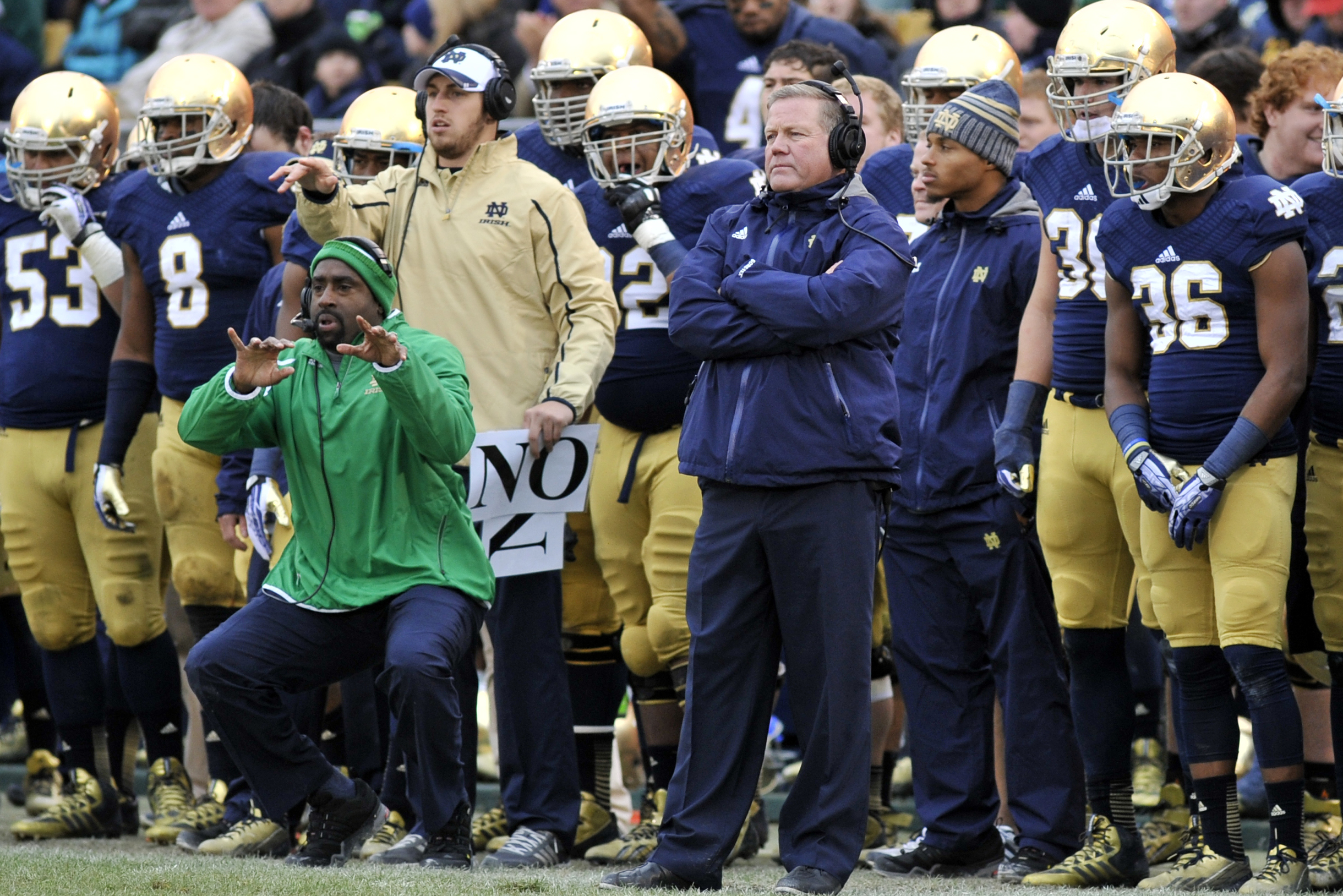 Notre Dame bench with Brian Kelly during a NCAA college football game between Notre Dame and Navy Saturday Nov. 2, 2013 in South Bend, Ind. (AP Photo/Joe Raymond)