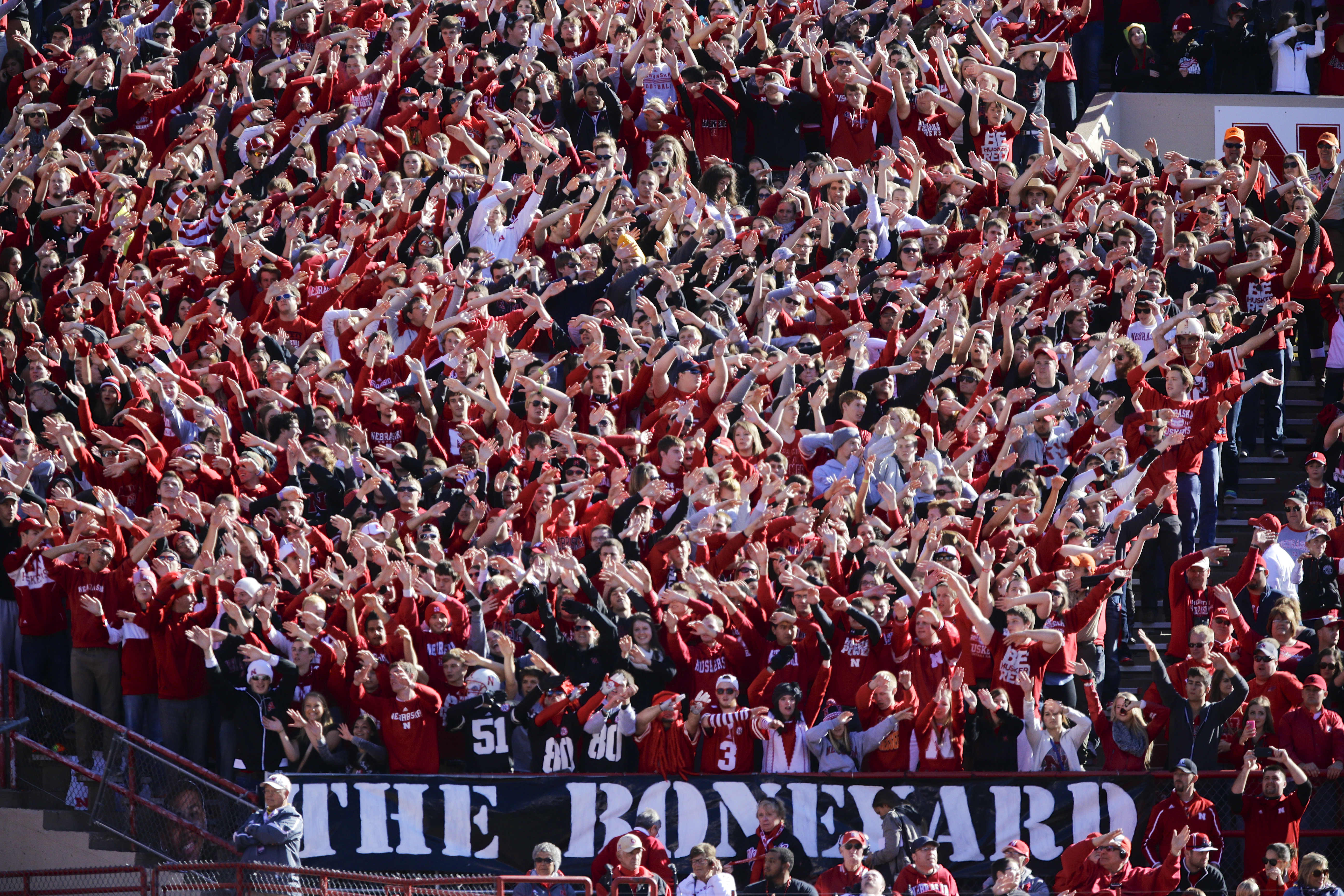 Nebraska fans wave their arms following a touchdown against Northwestern in the first half of an NCAA college football game in Lincoln, Neb., Saturday, Nov. 2, 2013. (AP Photo/Nati Harnik)