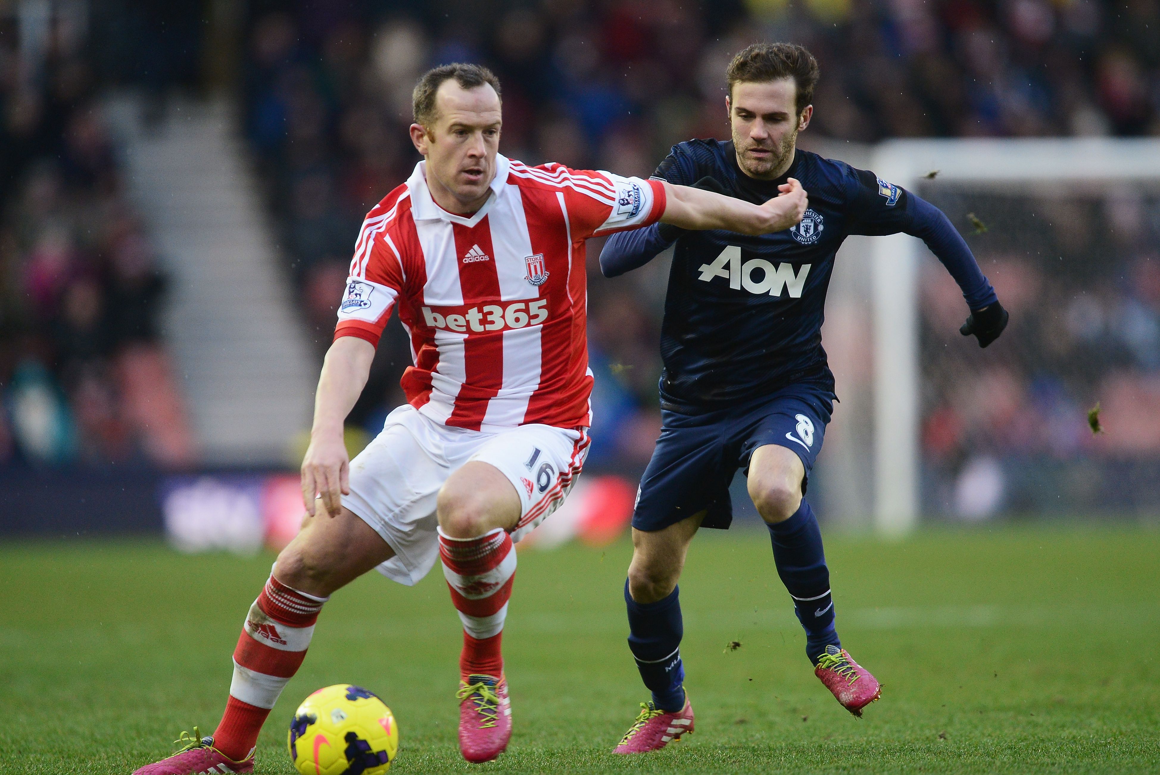 STOKE ON TRENT, ENGLAND - FEBRUARY 01:  Charlie Adam of Stoke City is closed down by Juan Mata of Manchester United during the Barclays Premier League match between Stoke City and Manchester United at Britannia Stadium on February 1, 2014 in Stoke on Trent, England.  (Photo by Jamie McDonald/Getty Images)