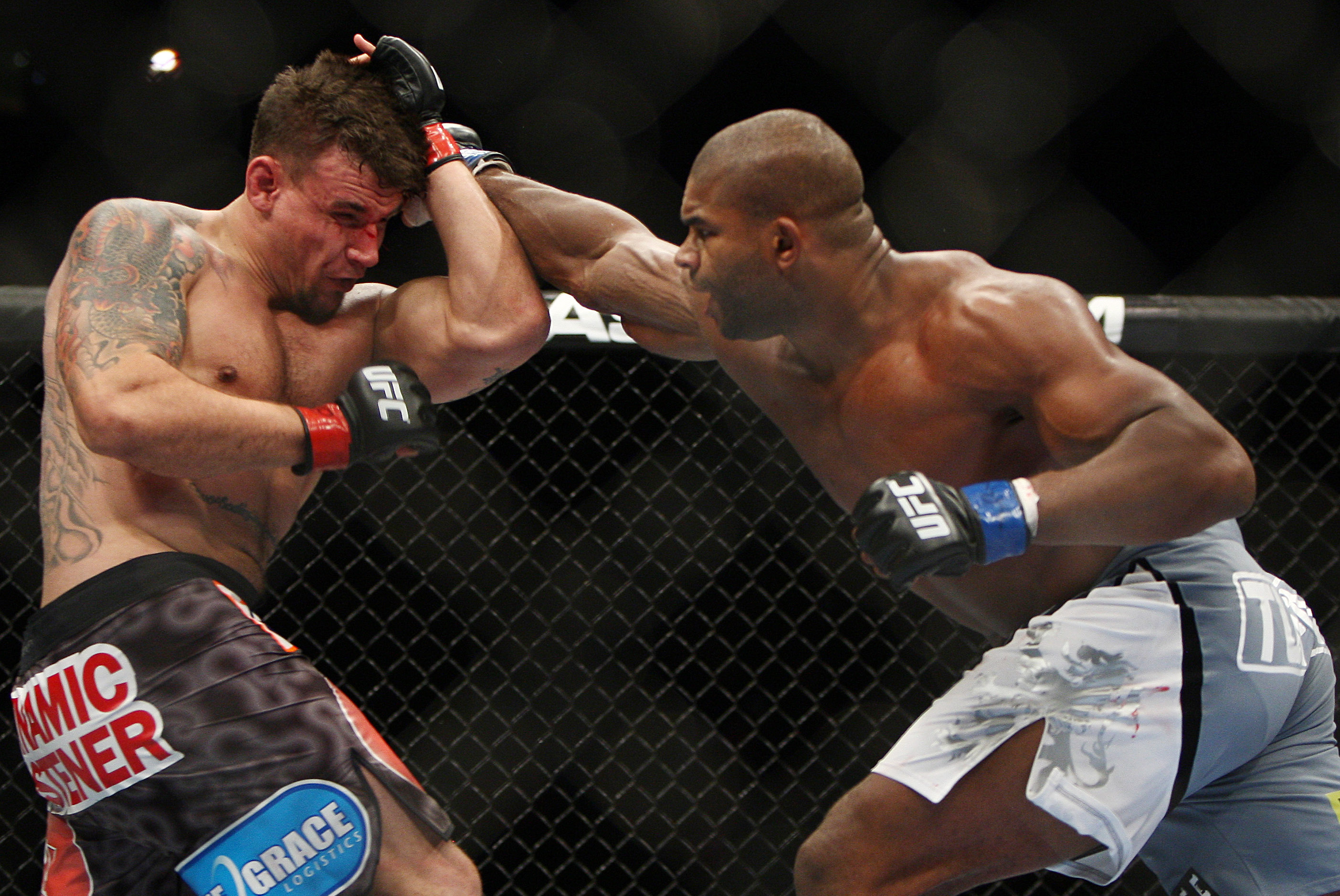 Frank Mir, left, and Alistair Overeem, of the Netherlands, fight during the second round of a UFC 169 heavyweight mixed martial arts bout in Newark, N.J., Saturday, Feb. 1, 2014. Overeem won by unanimous decision. (AP Photo/Tim Larsen)