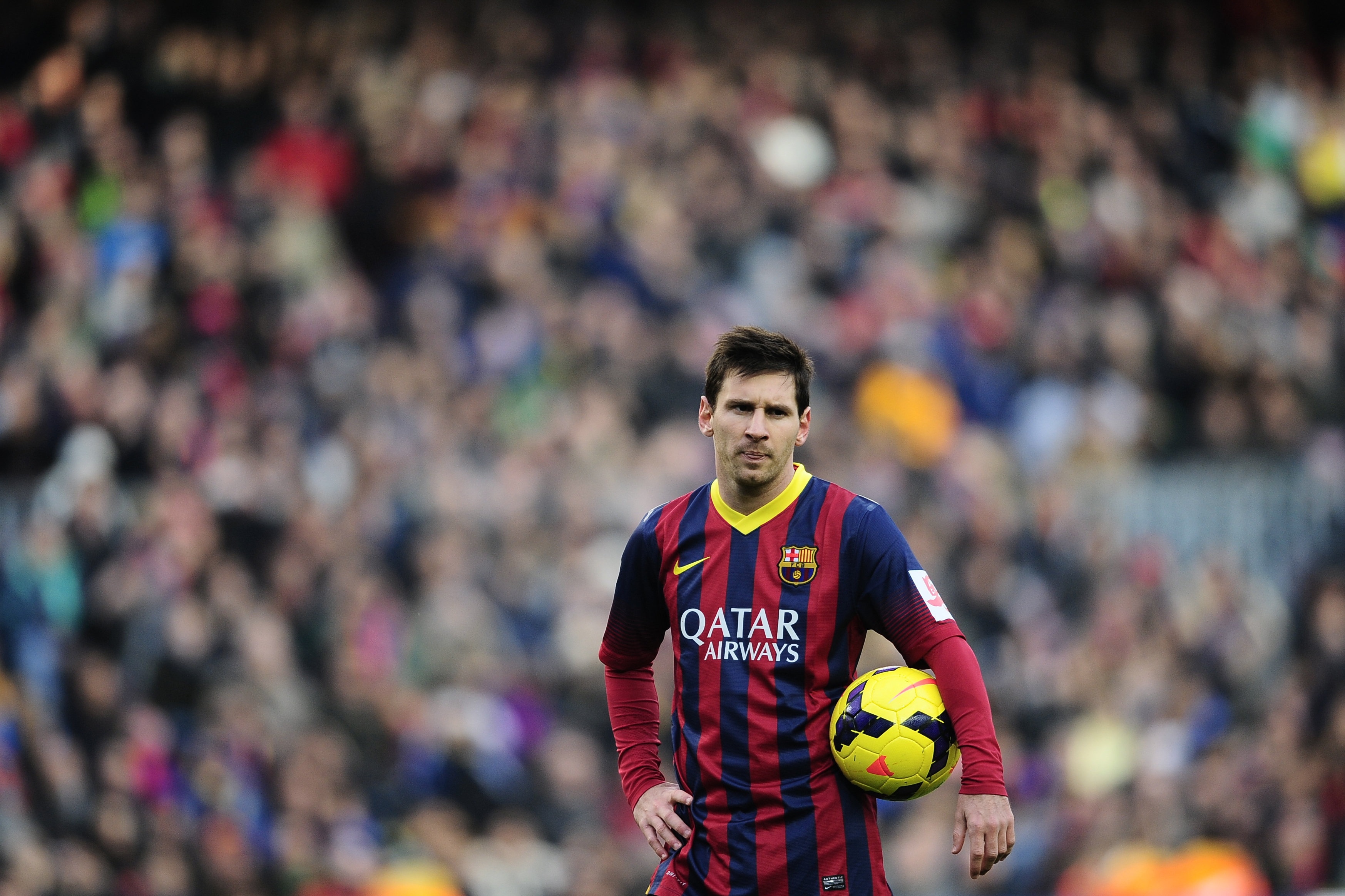 FC Barcelona's Lionel Messi, looks on against Valencia during a Spanish La Liga soccer match at the Camp Nou stadium in Barcelona, Spain, Saturday, Feb. 1, 2014. (AP Photo/Manu Fernandez)