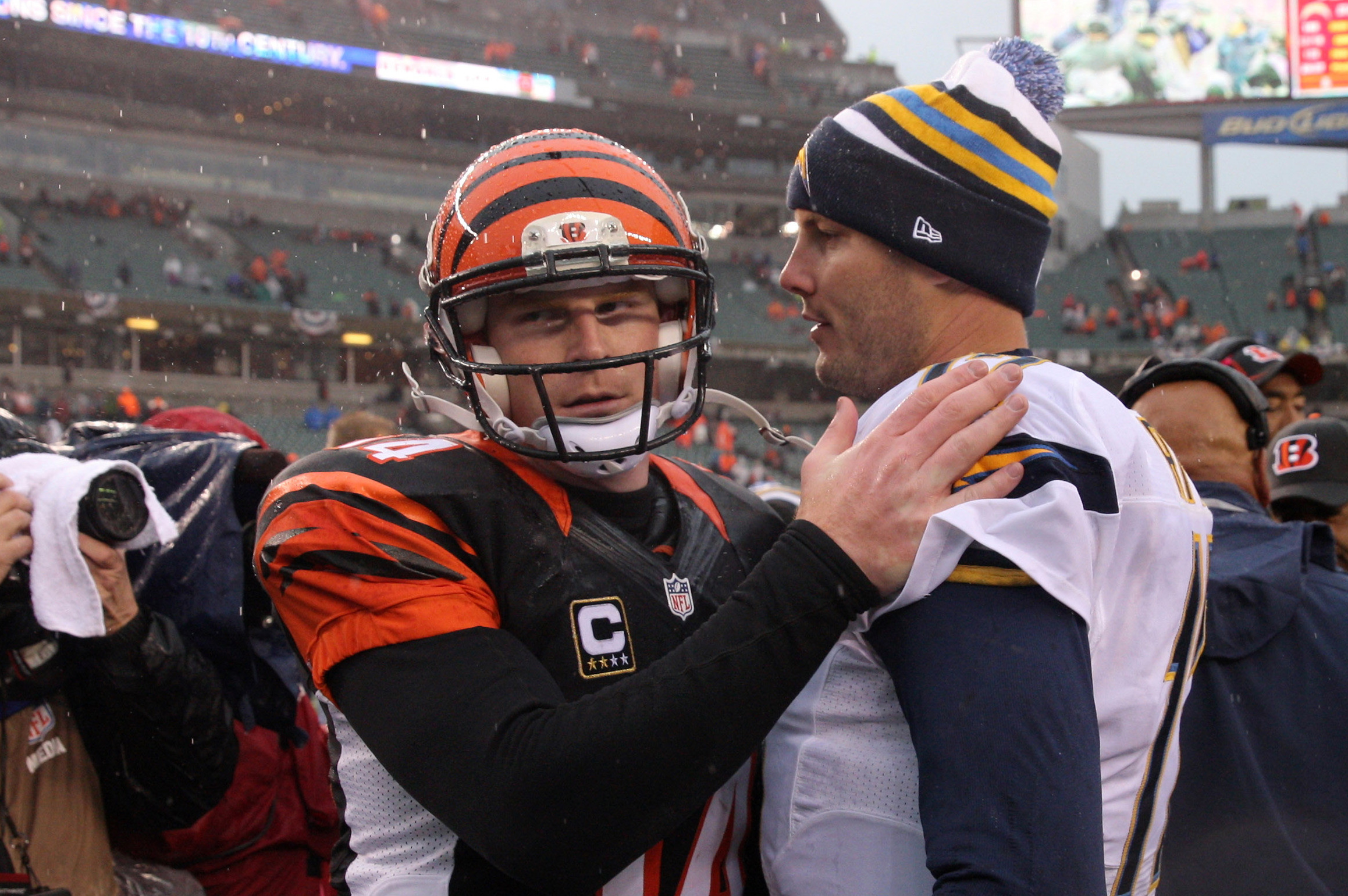 Jan 5, 2014; Cincinnati, OH, USA; Cincinnati Bengals quarterback Andy Dalton (14) and San Diego Chargers quarterback Philip Rivers (17) shake hands after the AFC wild card playoff football game at Paul Brown Stadium. San Diego won 27-10. Mandatory Credit: Pat Lovell-USA TODAY Sports