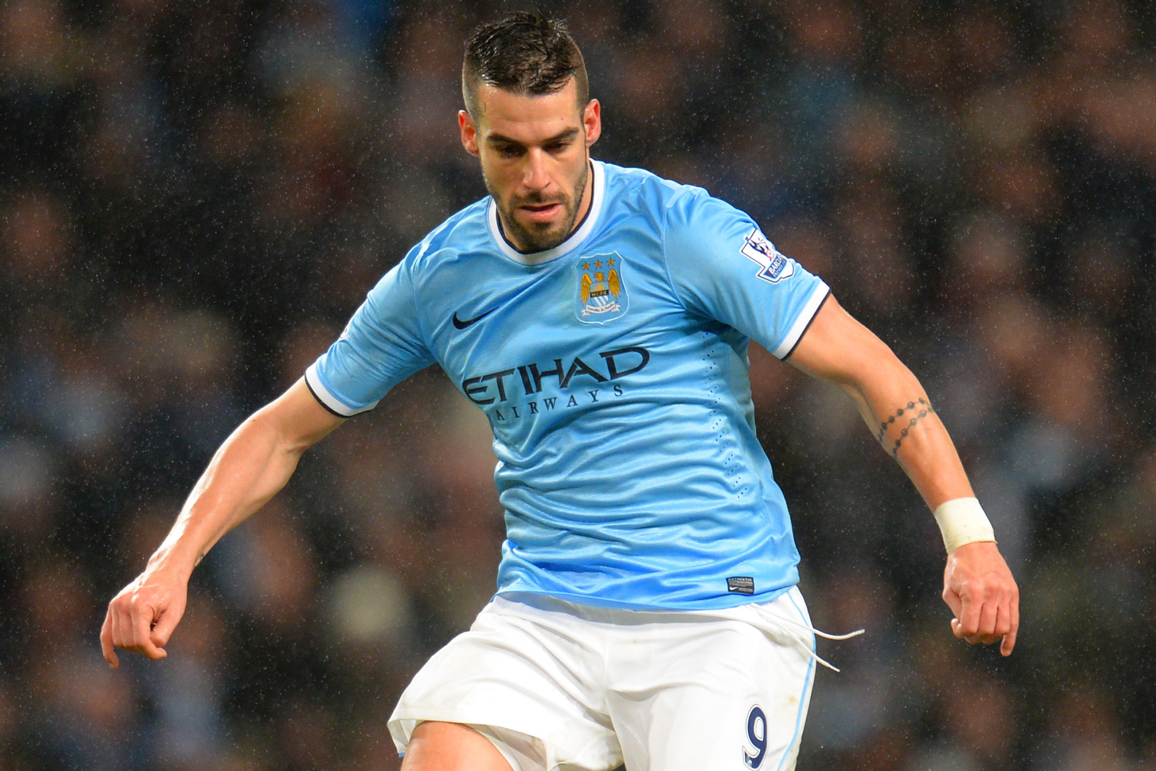 MANCHESTER, ENGLAND - JANUARY 08:  Alvaro Negredo of Manchester City on the ball during the Capital One Cup Semi-Final first leg match between Manchester City and West Ham United at Etihad Stadium on January 8, 2014 in Manchester, England.  (Photo by Shaun Botterill/Getty Images)
