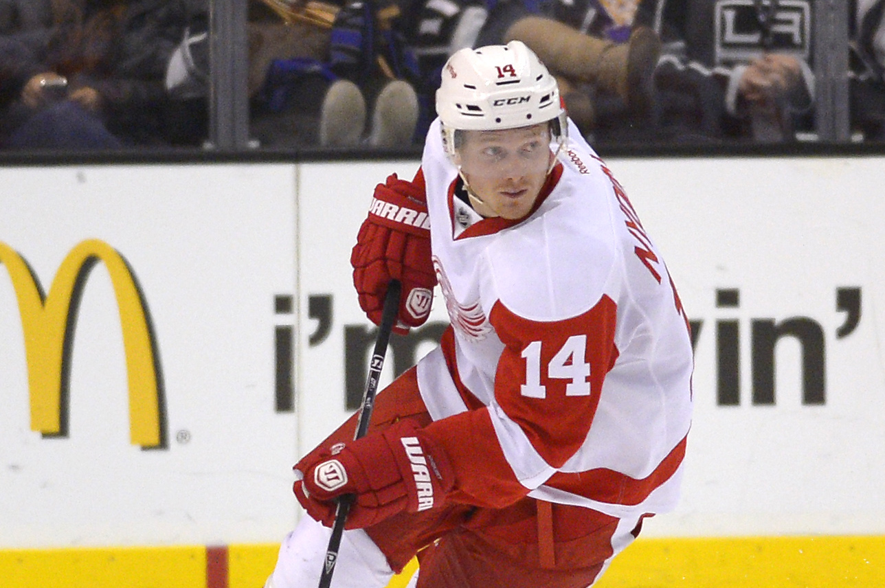 Detroit Red Wings center Gustav Nyquist, of Sweden, moves the puck during the first period of an NHL hockey game against the Los Angeles Kings, Saturday, Jan. 11, 2014, in Los Angeles. (AP Photo/Mark J. Terrill)