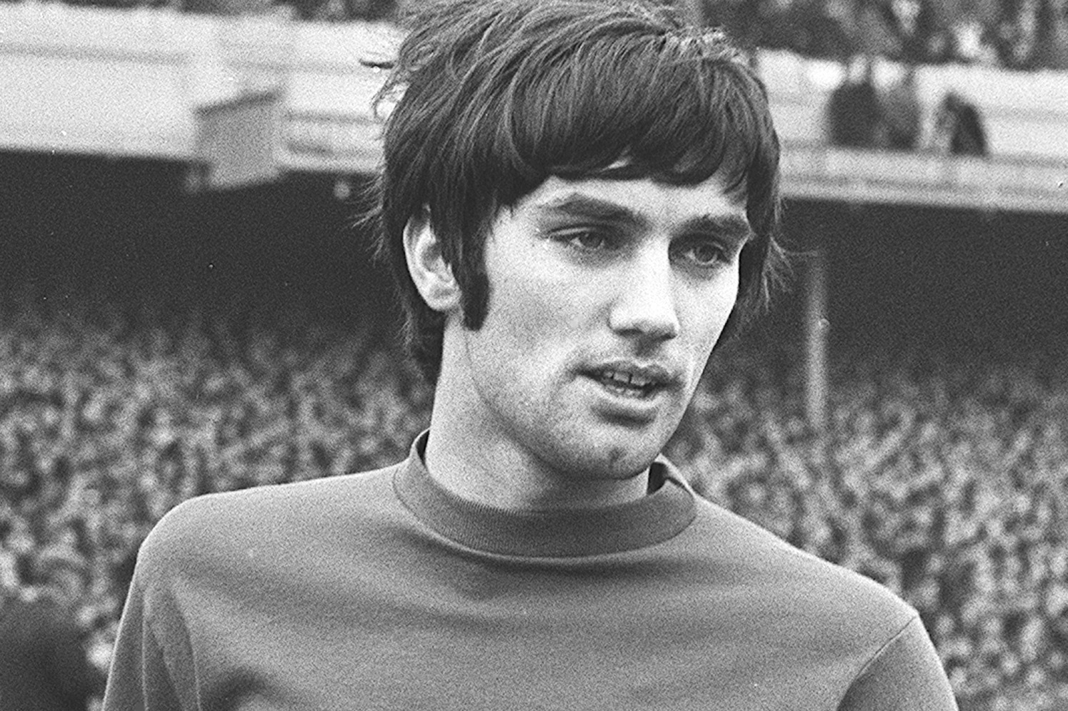 Northern Ireland and Manchester United footballer George Best stands on the pitch before a match at Highbury, London, Feb. 24, 1968. During the 1967-68 season Best scored 28 goals, earning him  both the Footballer of the Year and the European Player of the Year trophies. (AP Photo/Peter Kemp)