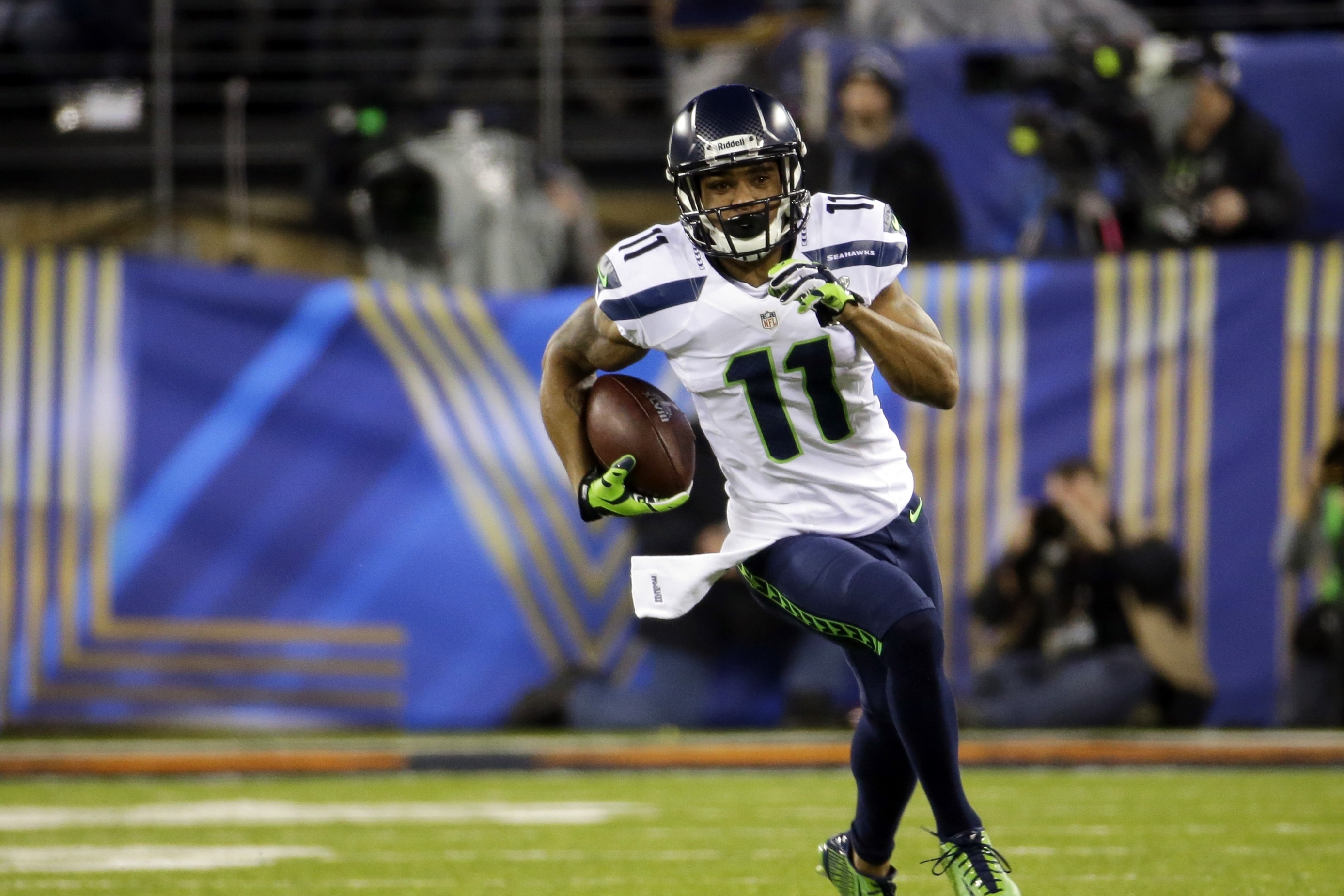 Seattle Seahawks' Percy Harvin (11) carries the ball during the first half of the NFL Super Bowl XLVIII football game against the Denver Broncos, Sunday, Feb. 2, 2014, in East Rutherford, N.J. (AP Photo/Ted S. Warren)