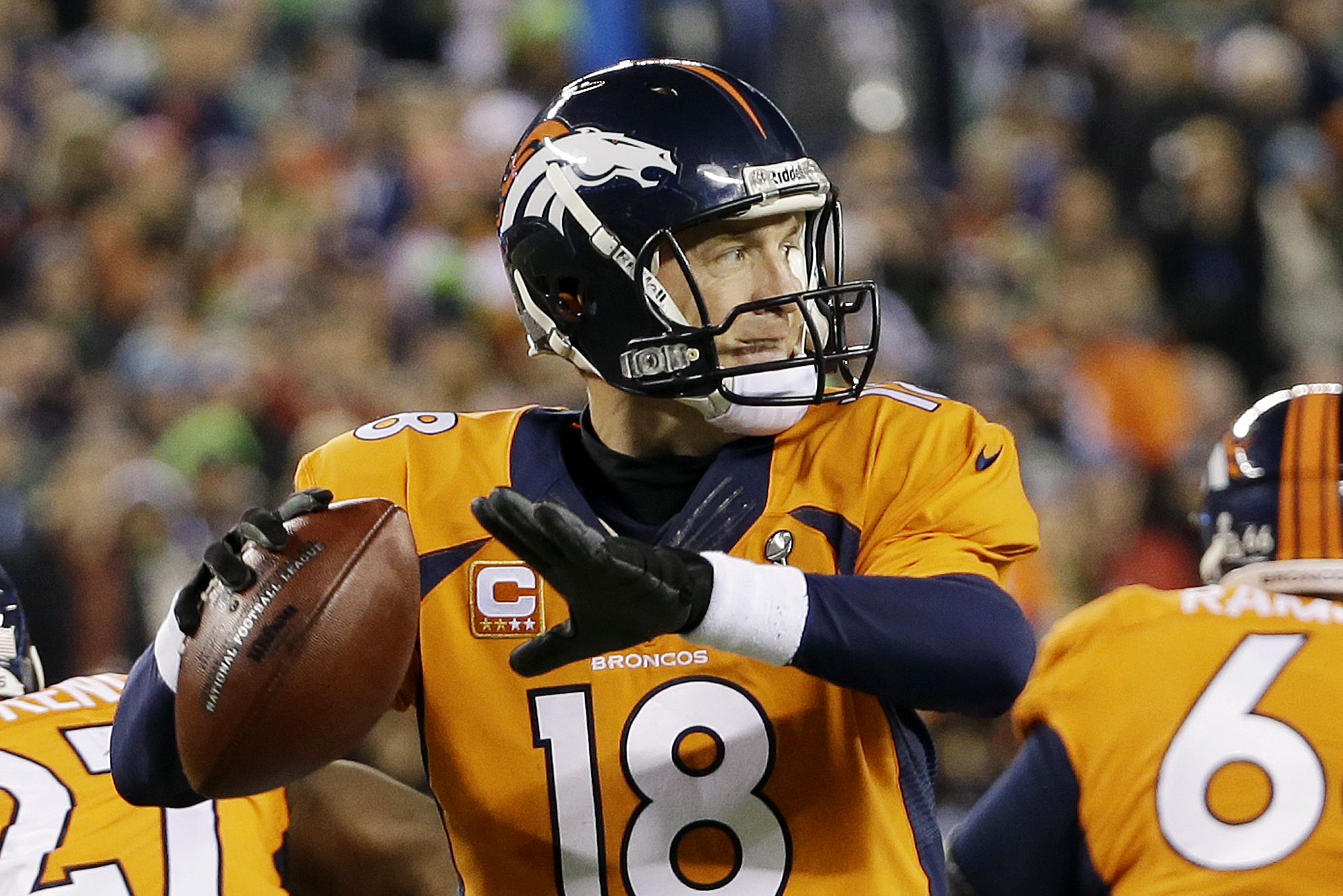 Denver Broncos' Peyton Manning looks to pass against the Seattle Seahawks during the first half of the NFL Super Bowl XLVIII football game Sunday, Feb. 2, 2014, in East Rutherford, N.J. (AP Photo/Mark Humphrey)