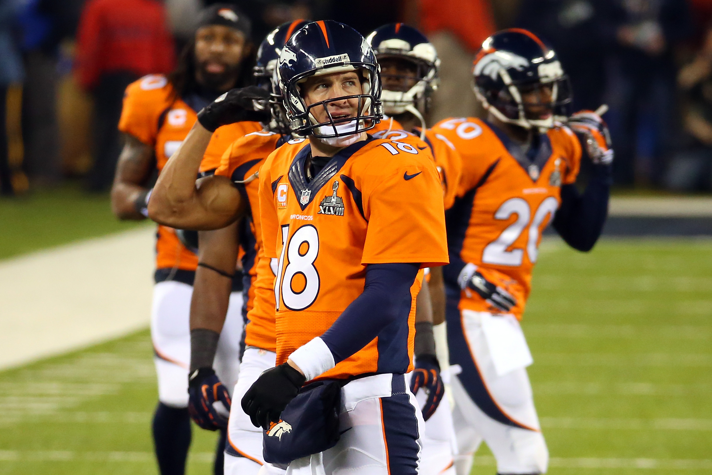EAST RUTHERFORD, NJ - FEBRUARY 02:  Quarterback Peyton Manning #18 of the Denver Broncos reacts against the Seattle Seahawks in the second half during Super Bowl XLVIII at MetLife Stadium on February 2, 2014 in East Rutherford, New Jersey.  (Photo by Ronald Martinez/Getty Images)