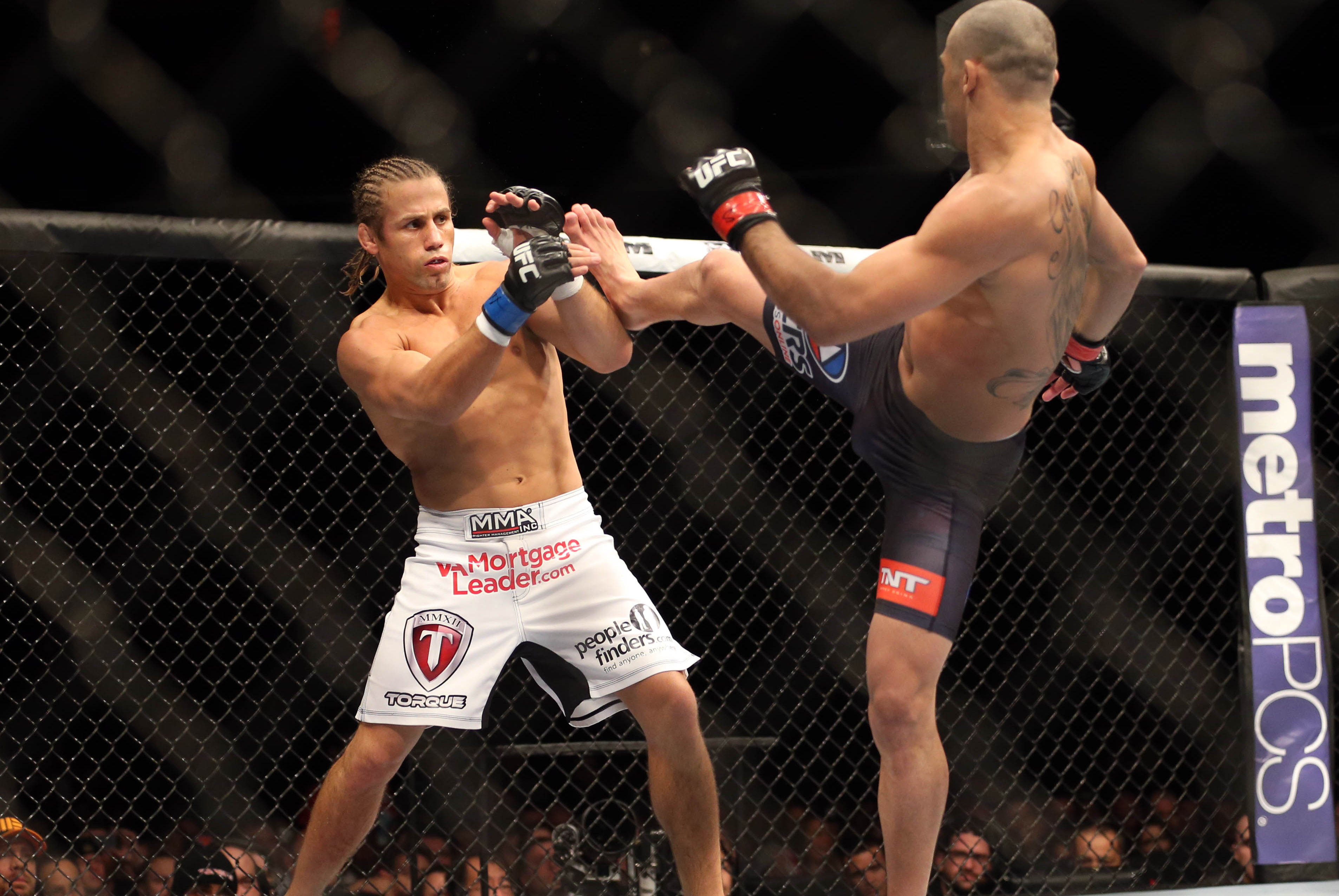 Feb 1, 2014; Newark, NJ, USA; Renan Barao (red gloves) fights Urijah Faber (blue gloves) during UFC 169 at Prudential Center. Mandatory Credit: Joe Camporeale-USA TODAY Sports