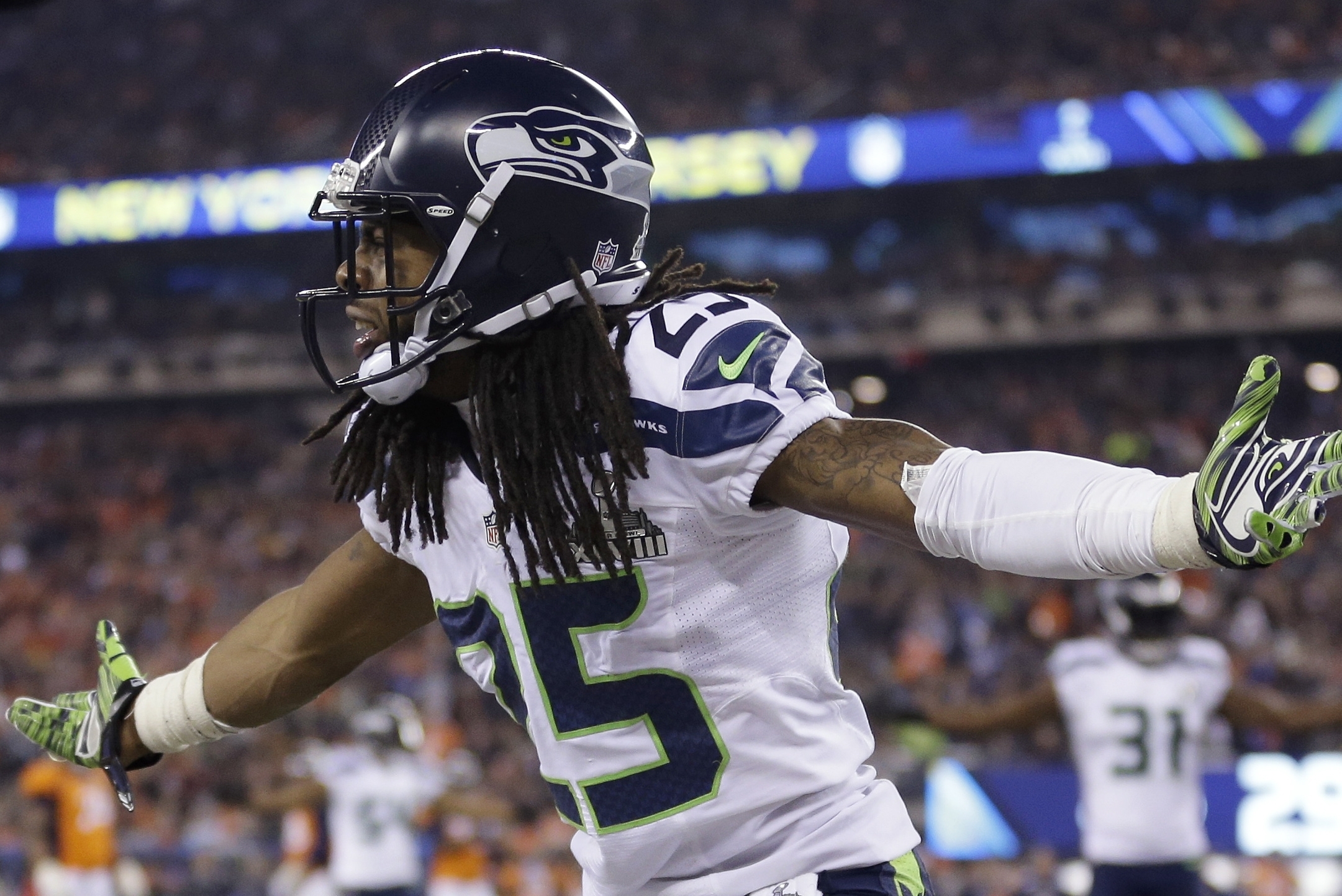 Seattle Seahawks' Richard Sherman (25) reacts during the second half of the NFL Super Bowl XLVIII football game against the Denver Broncos Sunday, Feb. 2, 2014, in East Rutherford, N.J. (AP Photo/Jeff Roberson)