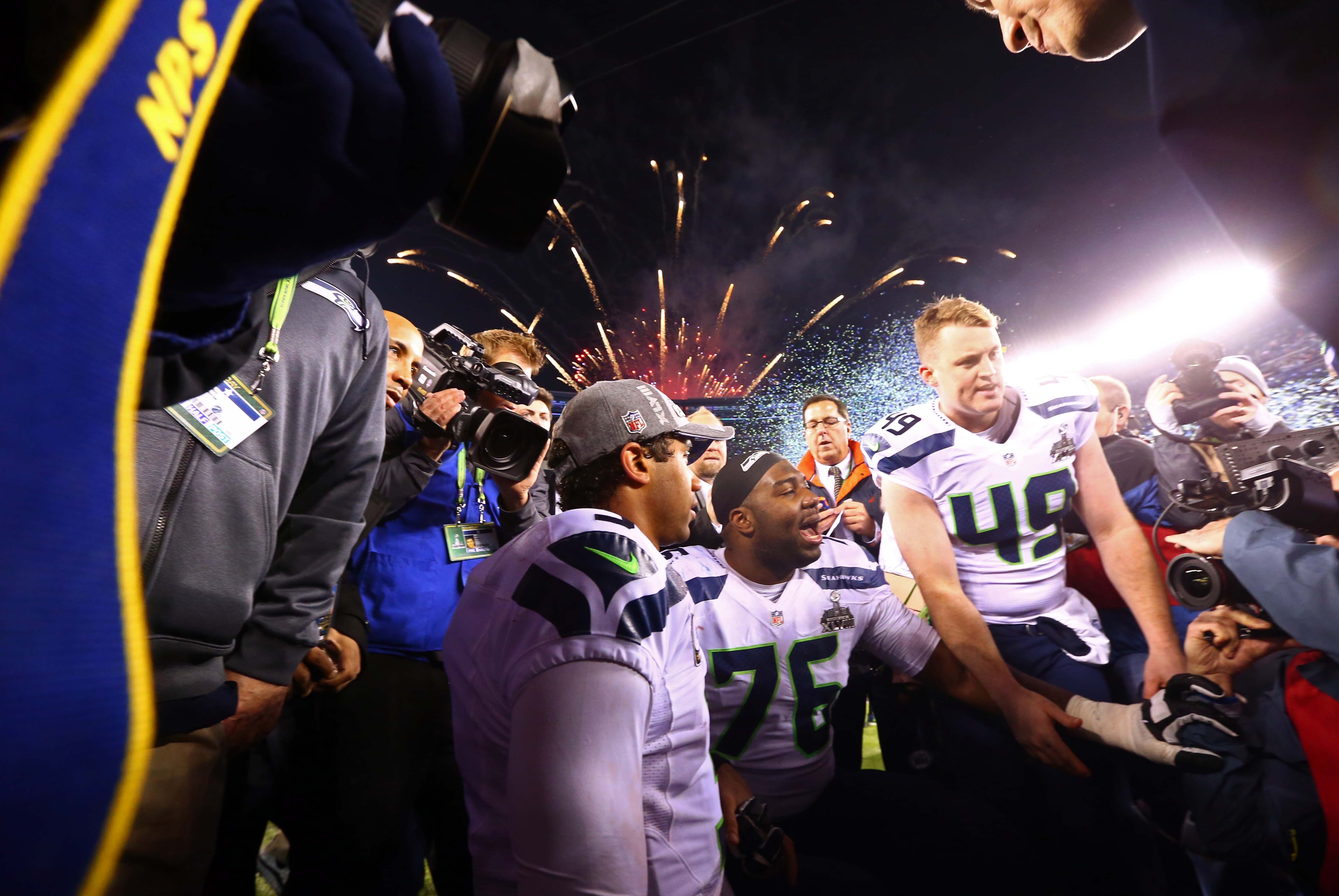 Feb 2, 2014; East Rutherford, NJ, USA; Seattle Seahawks quarterback Russell Wilson (3) kneels in prayer with his teammates after Super Bowl XLVIII against the Denver Broncos at MetLife Stadium.  Mandatory Credit: Mark J. Rebilas-USA TODAY Sports