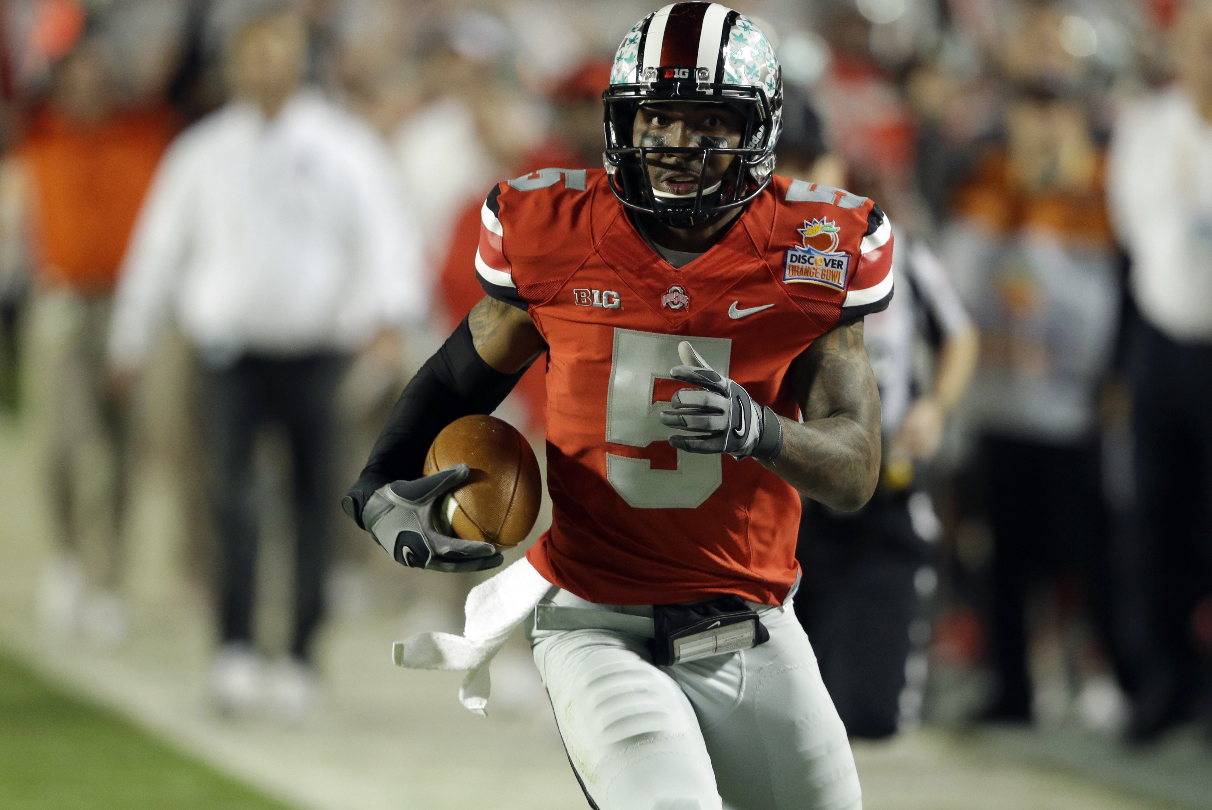 Ohio State quarterback Braxton Miller (5) runs on his way to scoring a touchdown during the first half of the Orange Bowl NCAA college football game, Friday, Jan. 3, 2014, in Miami Gardens, Fla. (AP Photo/Wilfredo Lee)