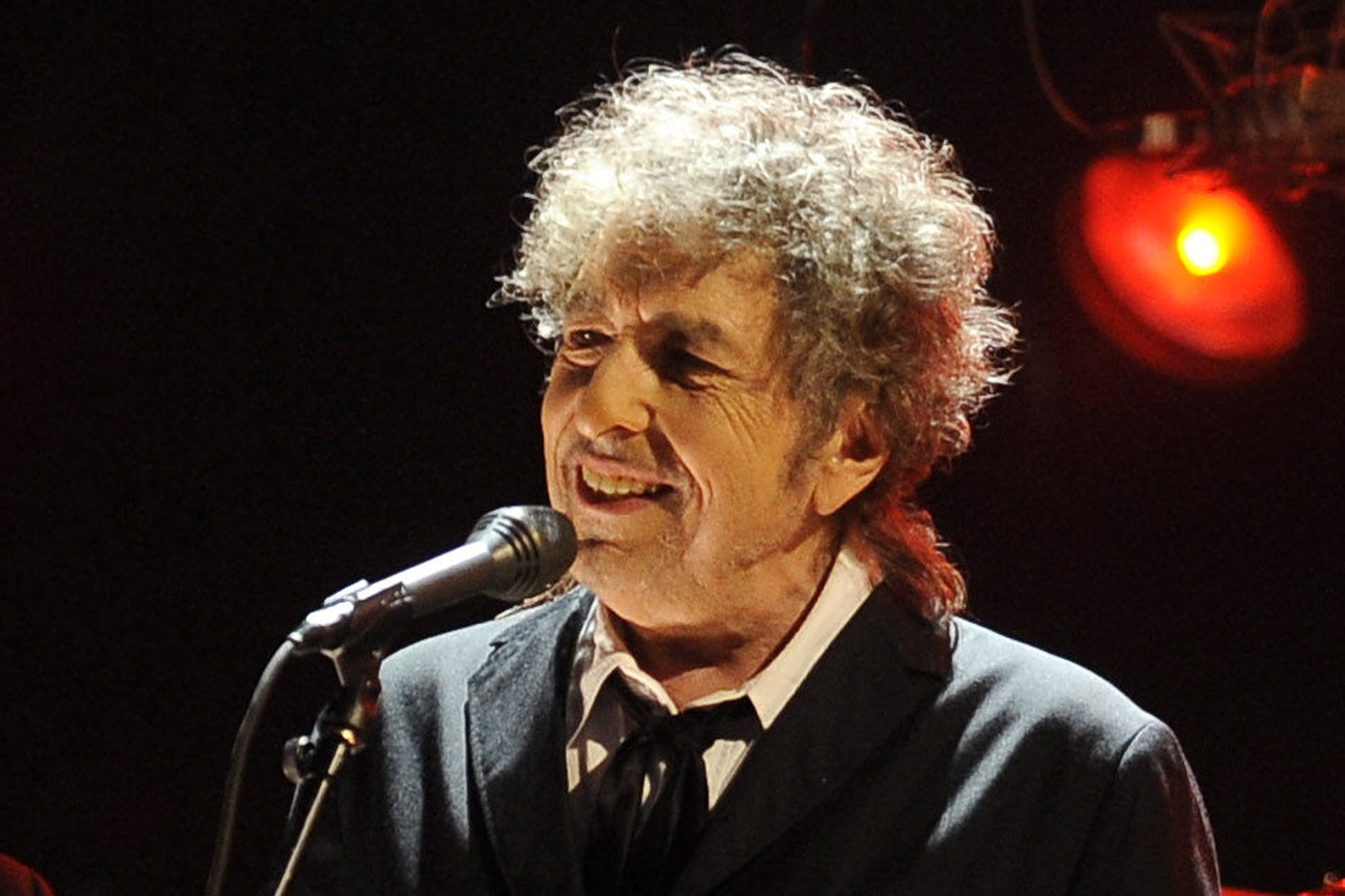 FILE - In this Jan. 12, 2012 file photo, Bob Dylan performs in Los Angeles. The electric guitar that Bob Dylan plugged in at the Newport Folk Festival in 1965 may be the most historic instrument in rock music, and it has sat mostly unnoticed in a New Jersey attic for most of the 47 years since. Dylan left it behind in an airplane and it was taken home by the pilot. The late pilot's daughter recently took it to PBS'