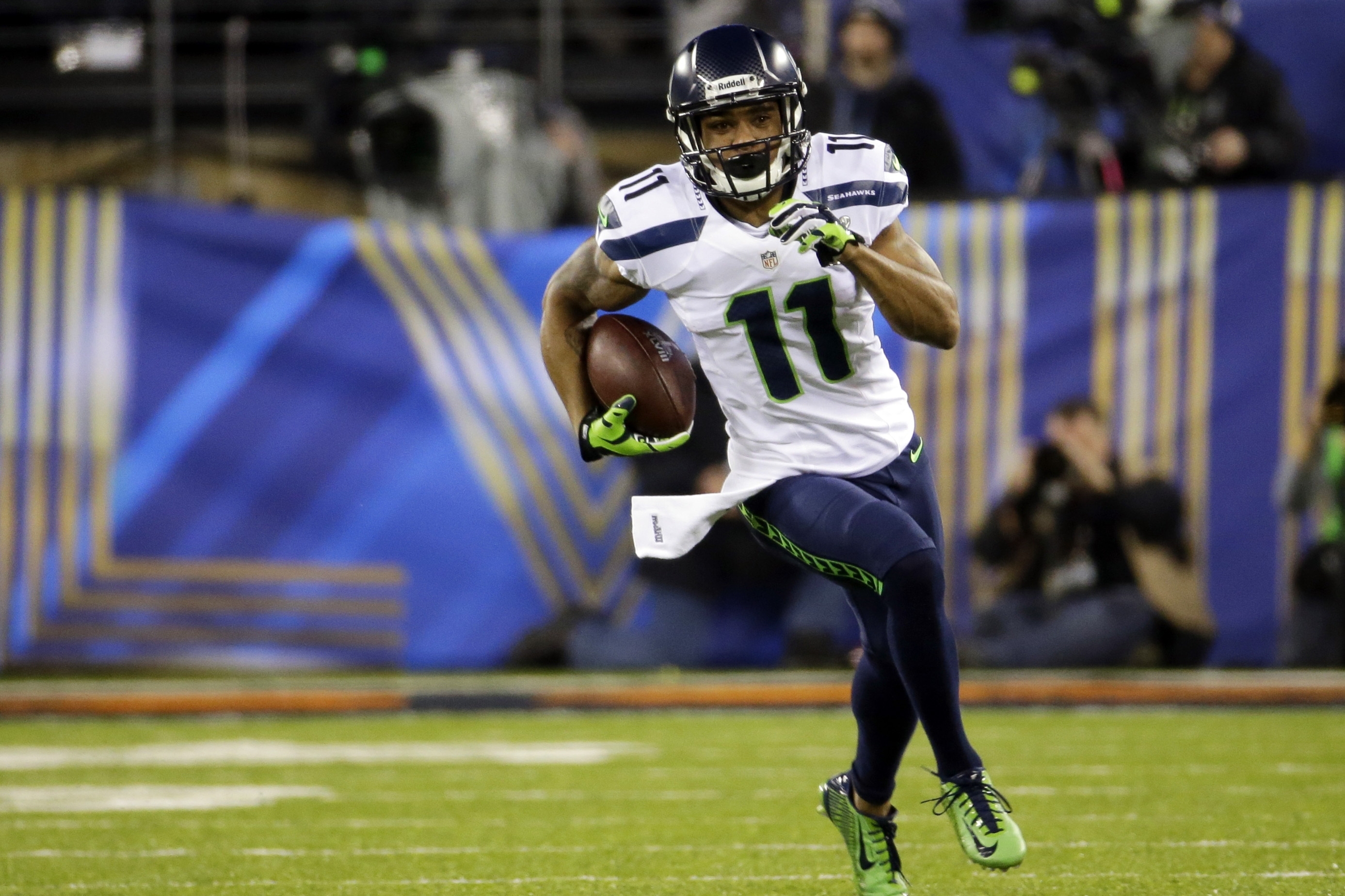 Seattle Seahawks' Percy Harvin (11) carries the ball during the first half of the NFL Super Bowl XLVIII football game against the Denver Broncos, Sunday, Feb. 2, 2014, in East Rutherford, N.J. (AP Photo/Ted S. Warren)
