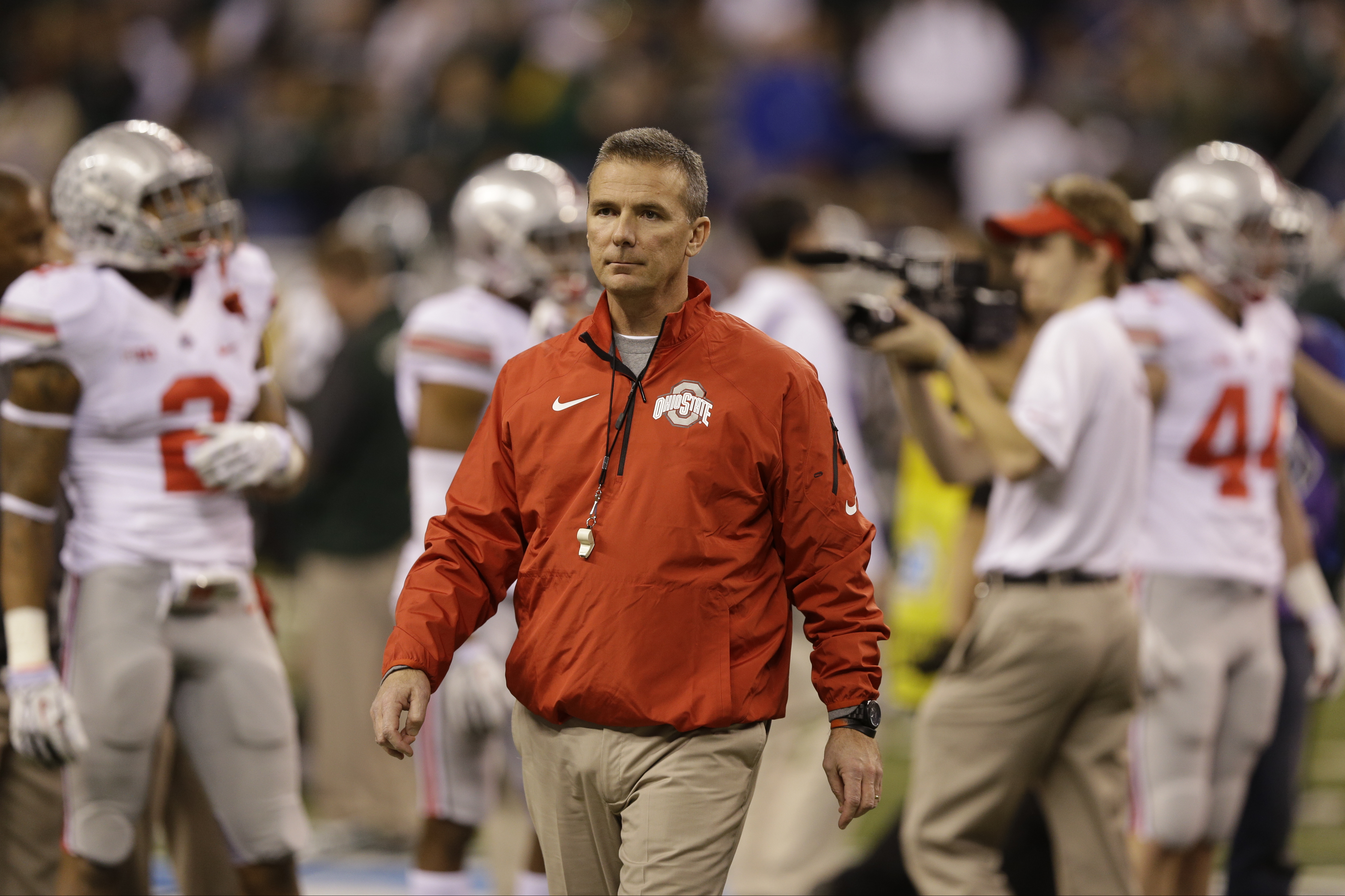 Ohio State head coach Urban Meyer watches as his team prepares for the Big Ten Conference championship NCAA college football game against Michigan State Saturday, Dec. 7, 2013, in Indianapolis. (AP Photo/Michael Conroy)