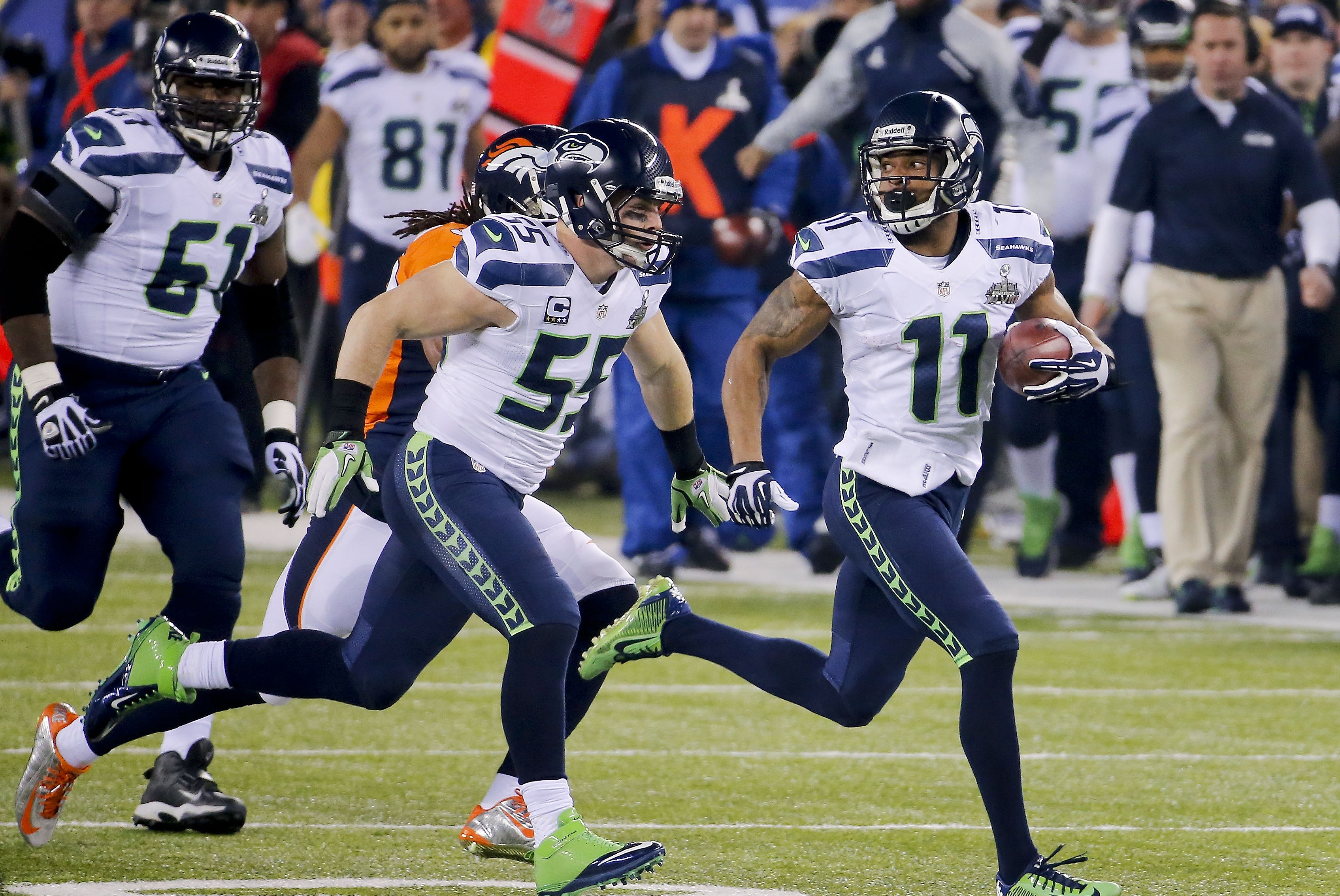 Seattle Seahawks wide receiver Percy Harvin (11) returns a kickoff for a touchdown against the Denver Broncos during the second half of the NFL Super Bowl XLVIII football game, Sunday, Feb. 2, 2014, in East Rutherford, N.J. (AP Photo/Matt York)
