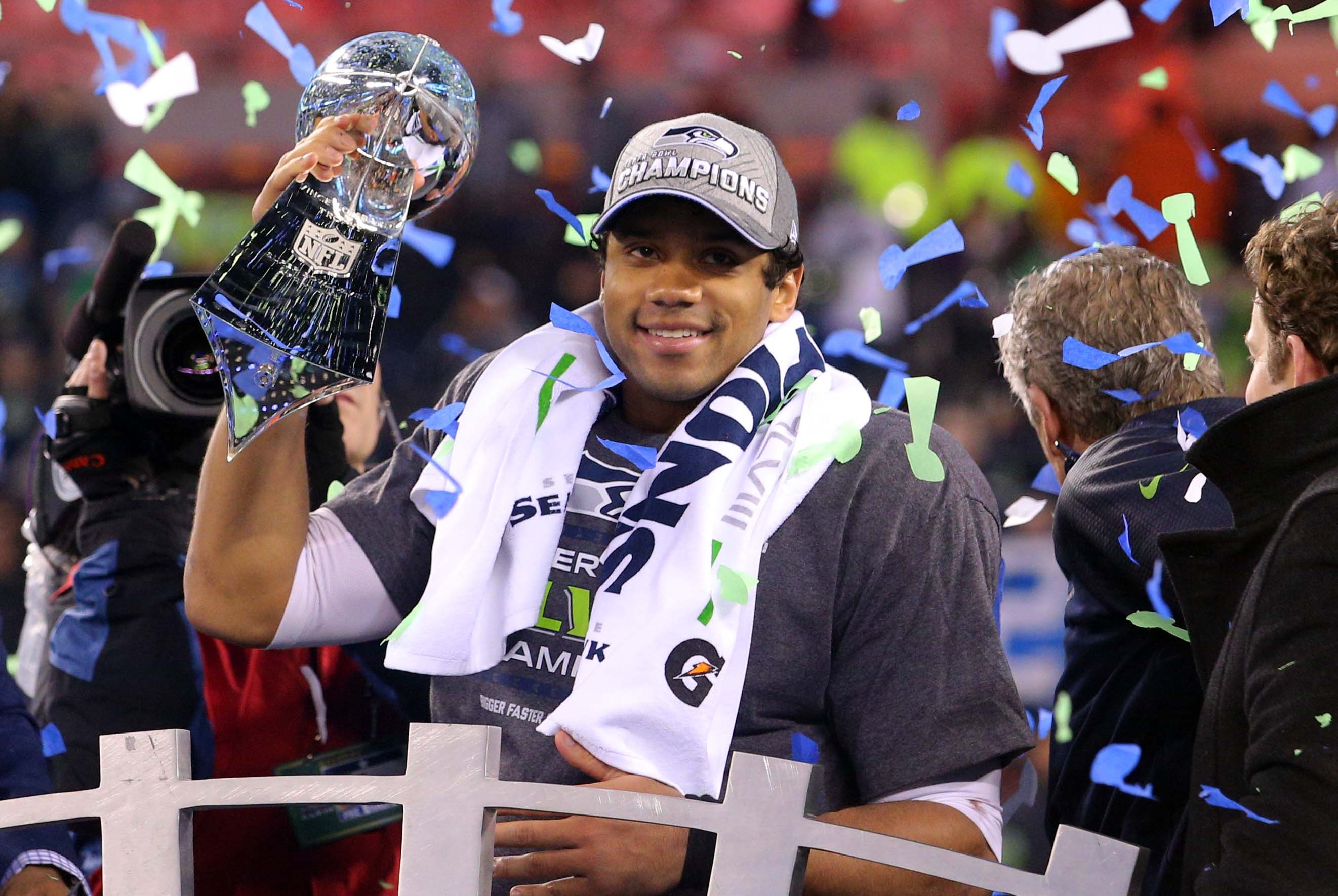 Feb 2, 2014; East Rutherford, NJ, USA; Seattle Seahawks quarterback Russell Wilson (3) celebrates with the Lombardi Trophy after beating the Denver Broncos 43-8 in Super Bowl XLVIII at MetLife Stadium.  Mandatory Credit: Brad Penner-USA TODAY Sports