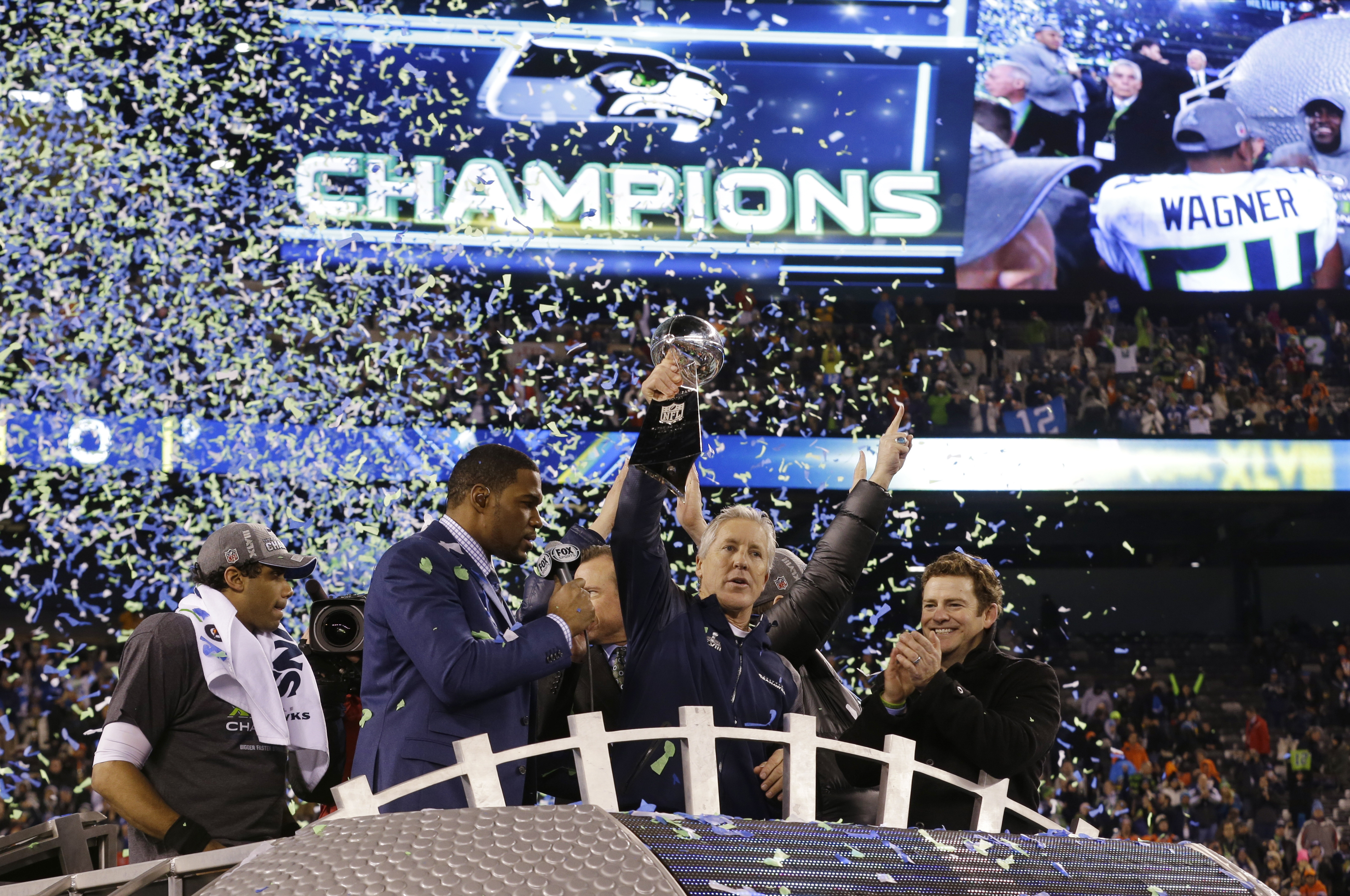 Seattle Seahawks head coach Pete Carroll holds the Vince Lombardi Trophy as he celebrates after the NFL Super Bowl XLVIII football game against the Denver Broncos Sunday, Feb. 2, 2014, in East Rutherford, N.J. The Seahawks won 43-8. (AP Photo/Ted S. Warren)
