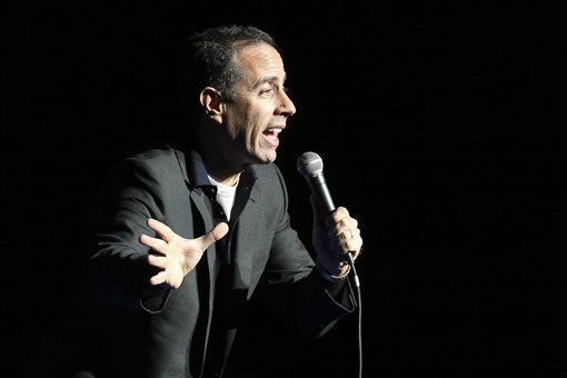 Comedian Jerry Seinfeld performs at the Stand Up for Heroes event at Madison Square Garden, Wednesday, Nov. 6, 2013, in New York. (John Minchillo/Invision/AP)