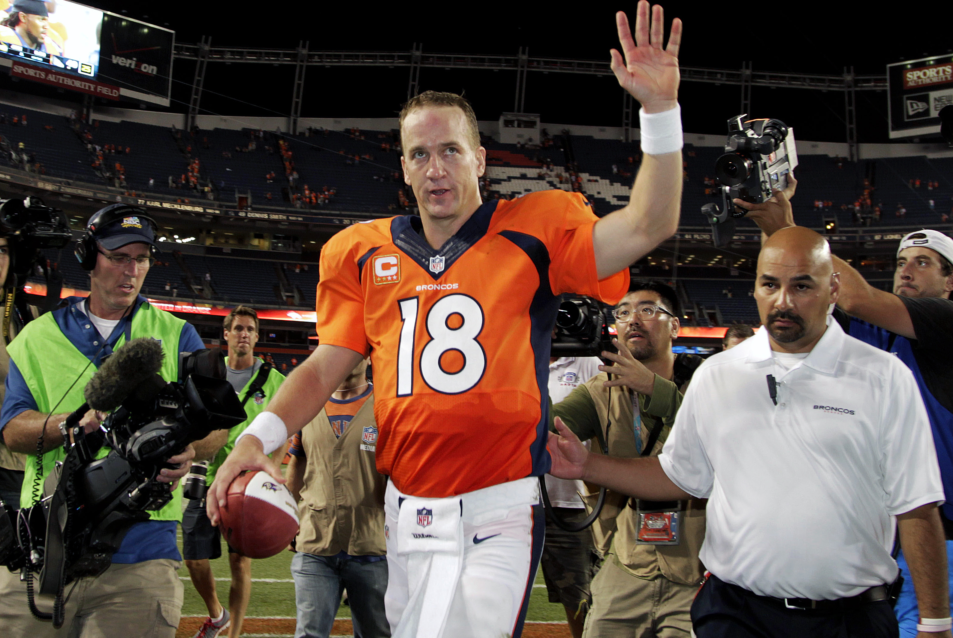 Denver Broncos quarterback Peyton Manning (18) walks off the field after an NFL football game against the Baltimore Ravens, Thursday, Sept. 5, 2013, in Denver. The Broncos won 49-27. Manning threw a record-tying seven touchdown passes — something no one had done in 44 years. (AP Photo/Joe Mahoney)