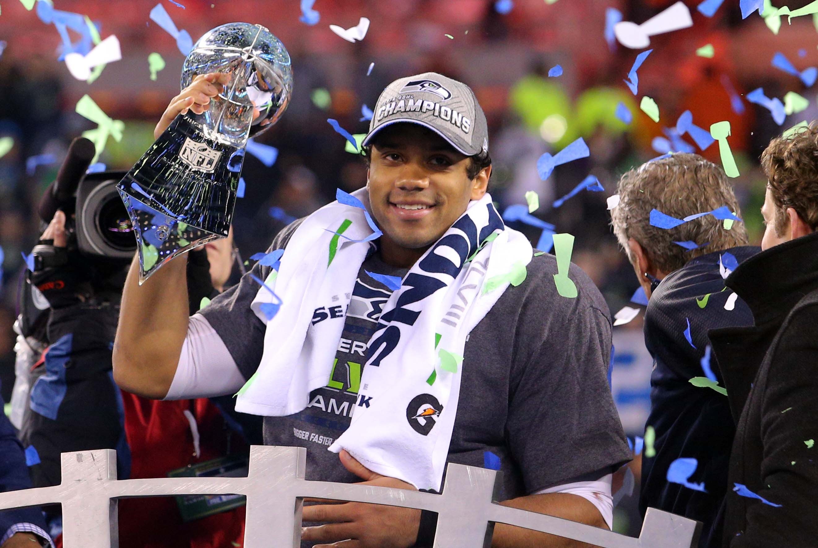 Feb 2, 2014; East Rutherford, NJ, USA; Seattle Seahawks quarterback Russell Wilson (3) celebrates with the Lombardi Trophy after beating the Denver Broncos 43-8 in Super Bowl XLVIII at MetLife Stadium.  Mandatory Credit: Brad Penner-USA TODAY Sports