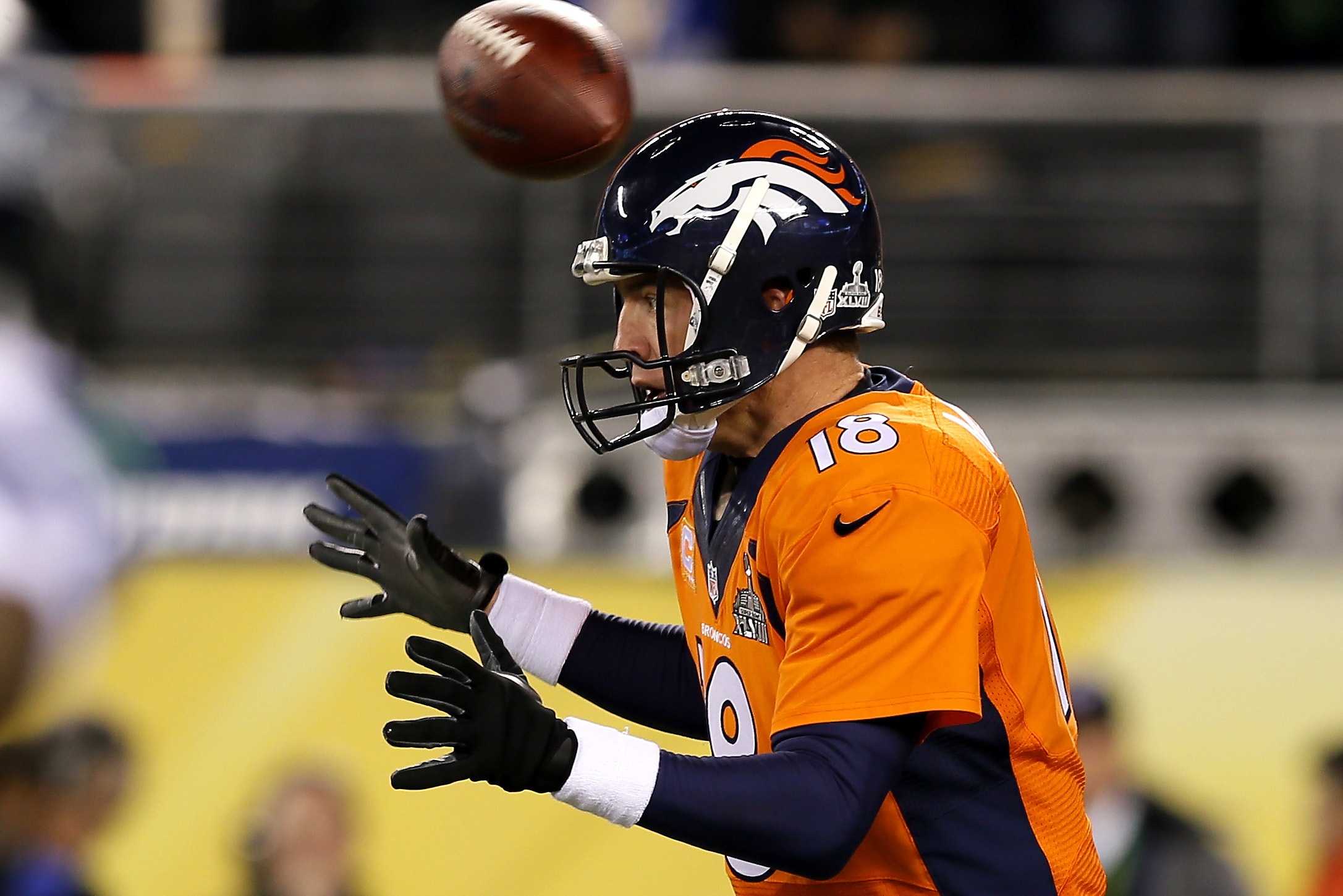EAST RUTHERFORD, NJ - FEBRUARY 02:  The ball flies over the head of quarterback Peyton Manning #18 of the Denver Broncos in the first quarter against the Seattle Seahawks during Super Bowl XLVIII at MetLife Stadium on February 2, 2014 in East Rutherford, New Jersey.  (Photo by Kevin C. Cox/Getty Images)