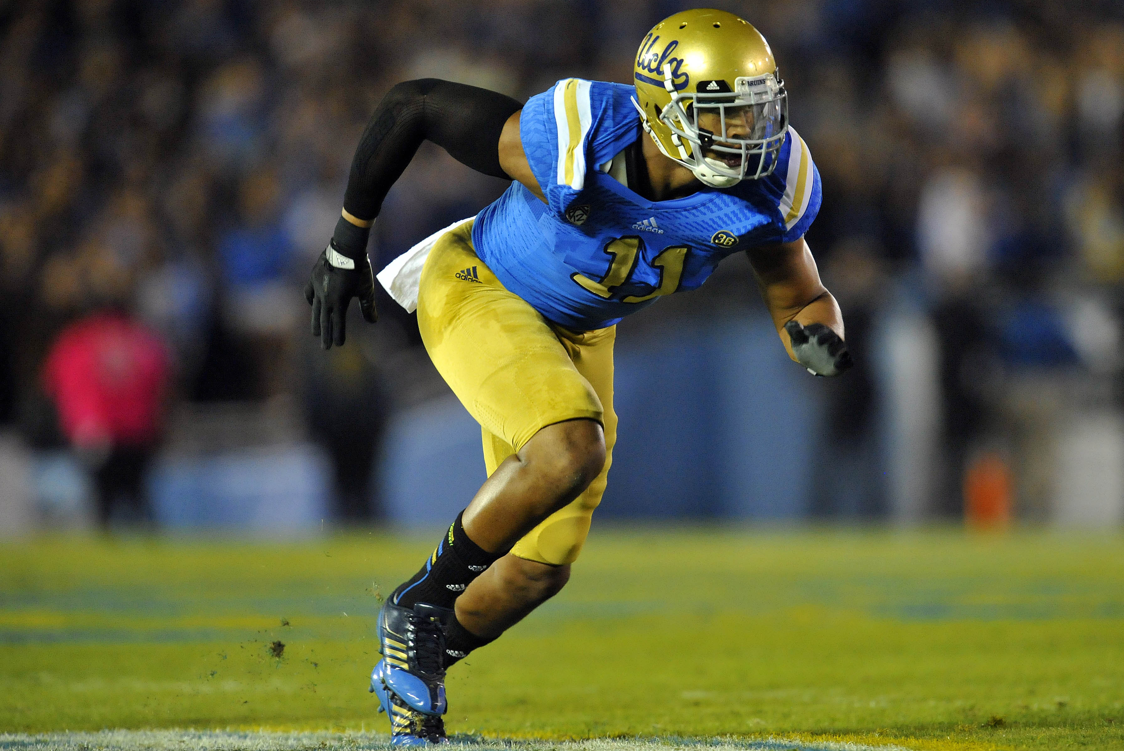 October 12, 2013; Pasadena, CA, USA; UCLA Bruins linebacker Anthony Barr (11) defends against the California Golden Bears during the first half at the Rose Bowl. Mandatory Credit: Gary A. Vasquez-USA TODAY Sports