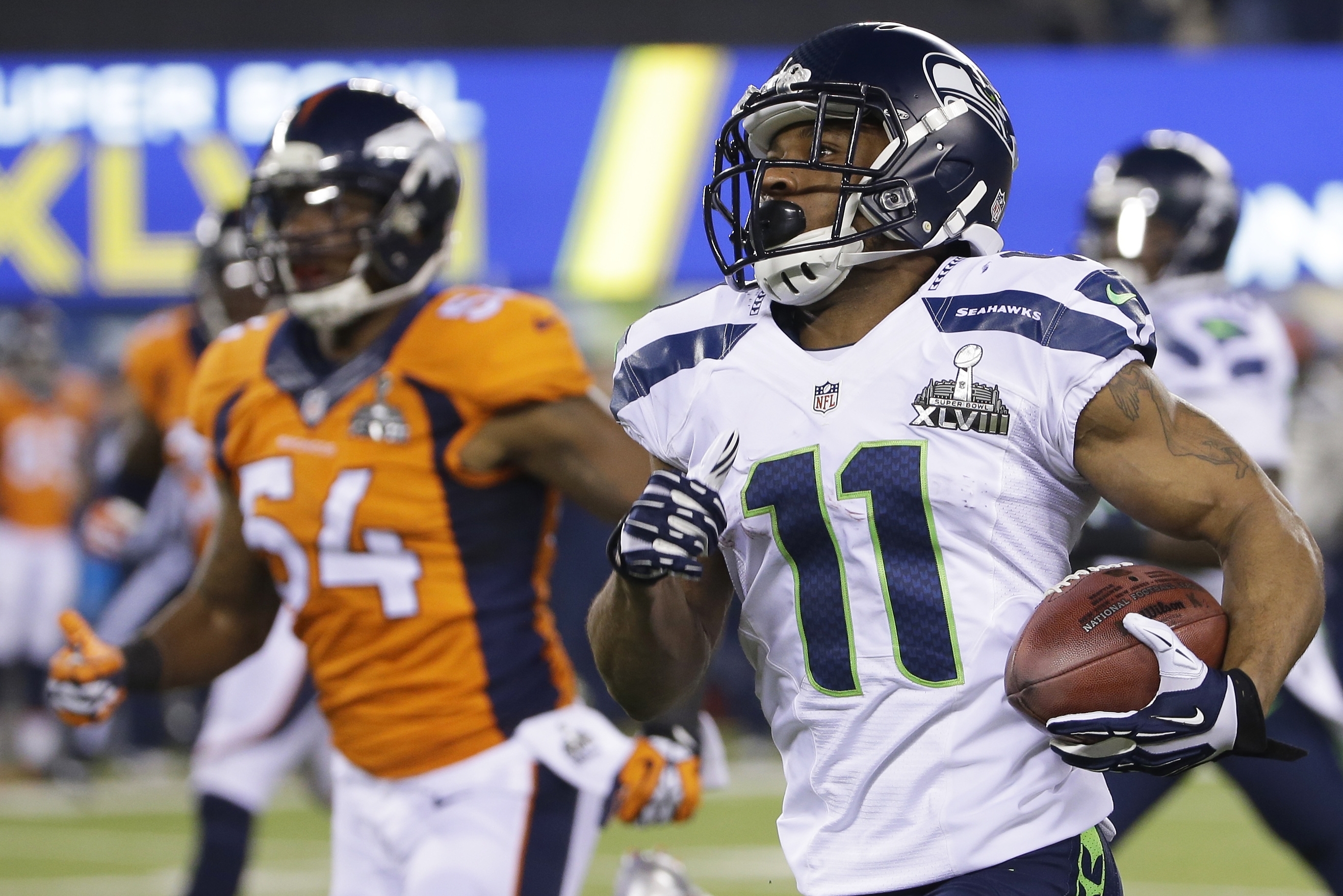 Seattle Seahawks' Percy Harvin (11) returns a kickoff 87-yards for a touchdown during the second half of the NFL Super Bowl XLVIII football game against the Denver Broncos Sunday, Feb. 2, 2014, in East Rutherford, N.J. (AP Photo/Matt Slocum)