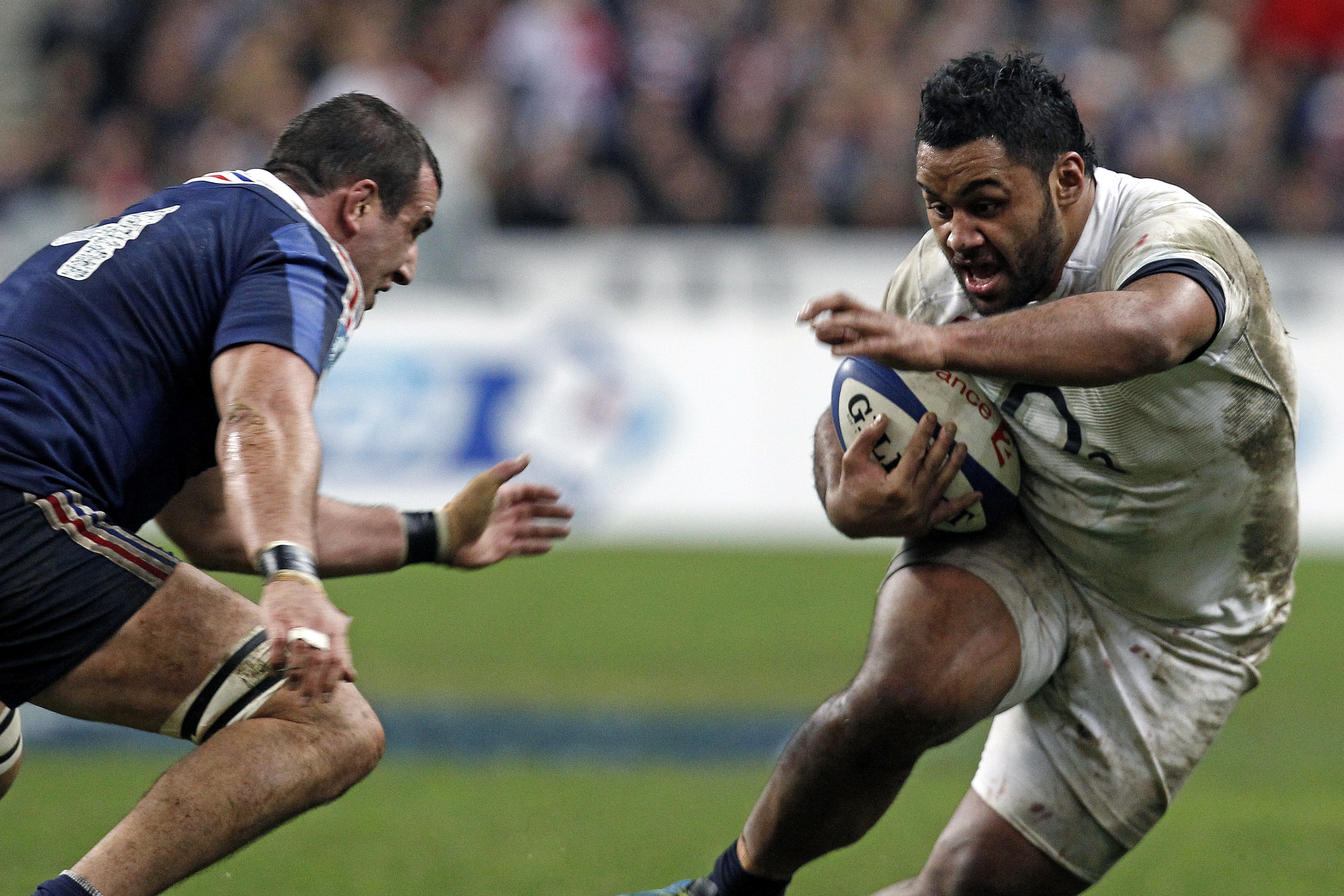 England's Billy Vunipola runs with the ball as France's Yoann Maestri tries to stop him, during their Six Nations rugby union international match, at the Stade de France, in Saint Denis, outside Paris, Saturday, Feb 1, 2014. France defeated England 26-24. (AP Photo/Thibault Camus)
