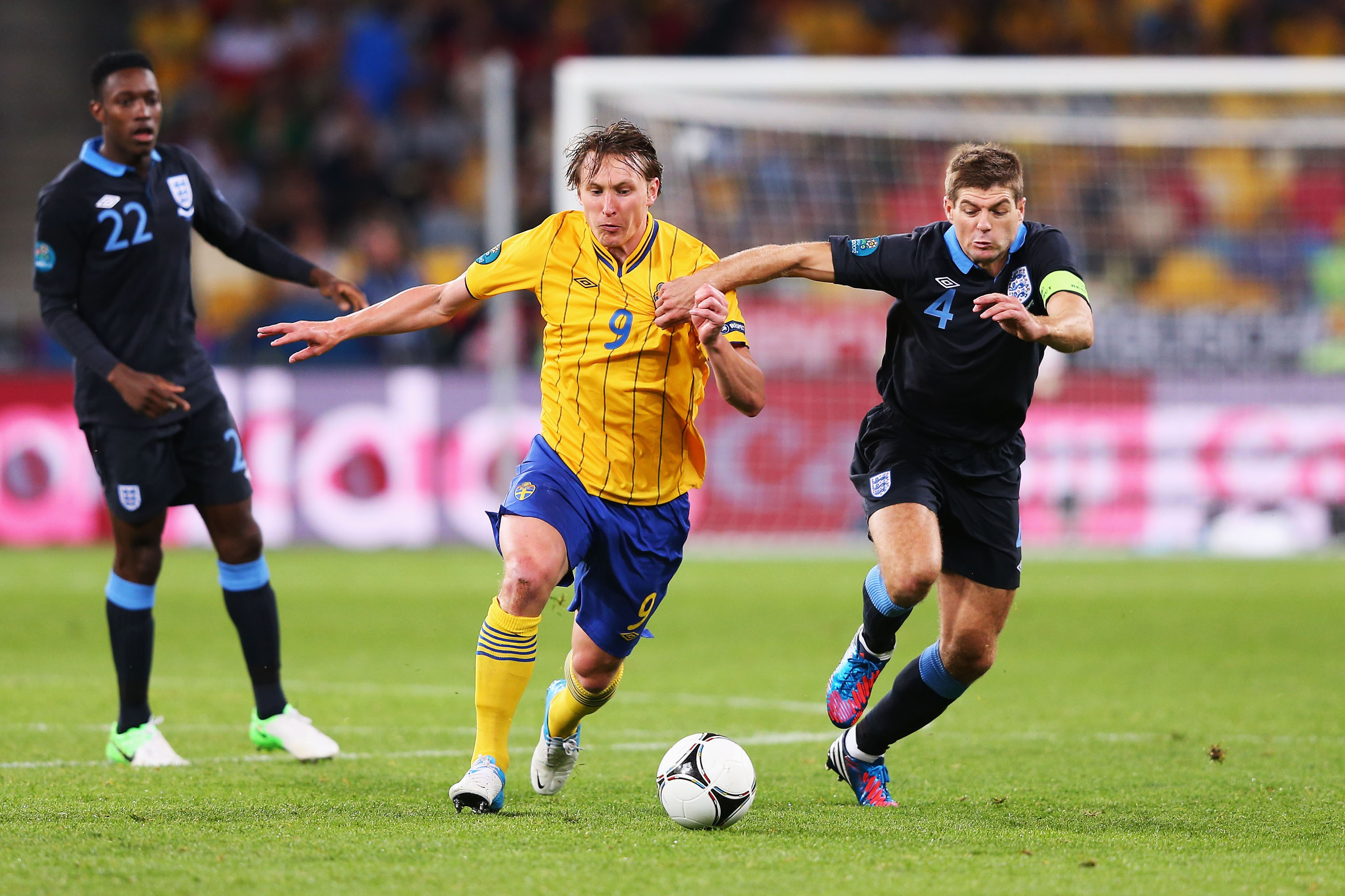 KIEV, UKRAINE - JUNE 15:  Kim Kallstrom of Sweden and Steven Gerrard of England battle for the ball during the UEFA EURO 2012 group D match between Sweden and England at The Olympic Stadium on June 15, 2012 in Kiev, Ukraine.  (Photo by Alex Livesey/Getty Images)
