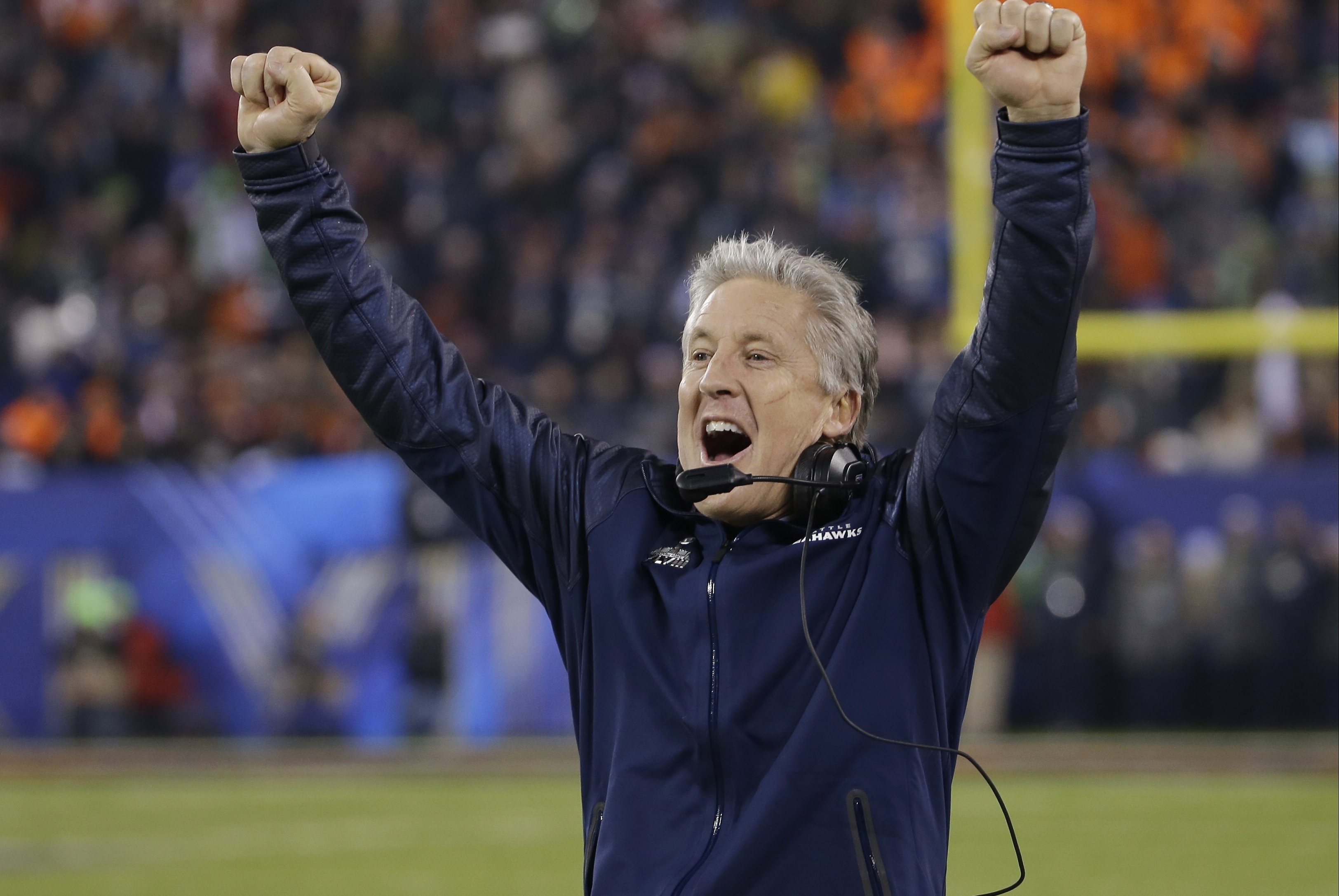 Seattle Seahawks head coach Pete Carroll reacts as Percy Harvin returns a kickoff for a touchdown during the second half of the NFL Super Bowl XLVIII football game against the Denver Broncos Sunday, Feb. 2, 2014, in East Rutherford, N.J. (AP Photo/Matt Slocum)
