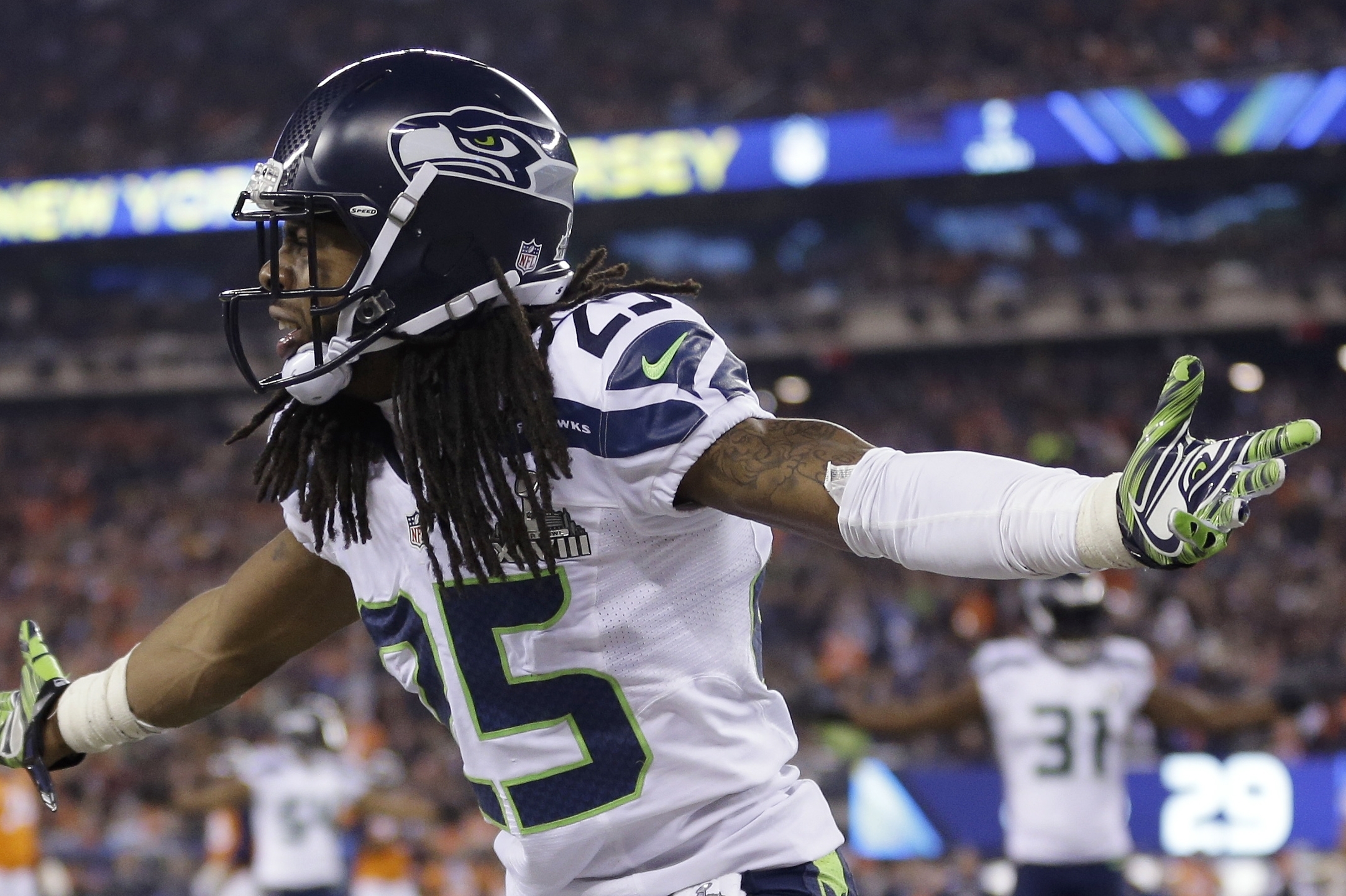 Seattle Seahawks' Richard Sherman (25) reacts during the second half of the NFL Super Bowl XLVIII football game against the Denver Broncos Sunday, Feb. 2, 2014, in East Rutherford, N.J. (AP Photo/Jeff Roberson)
