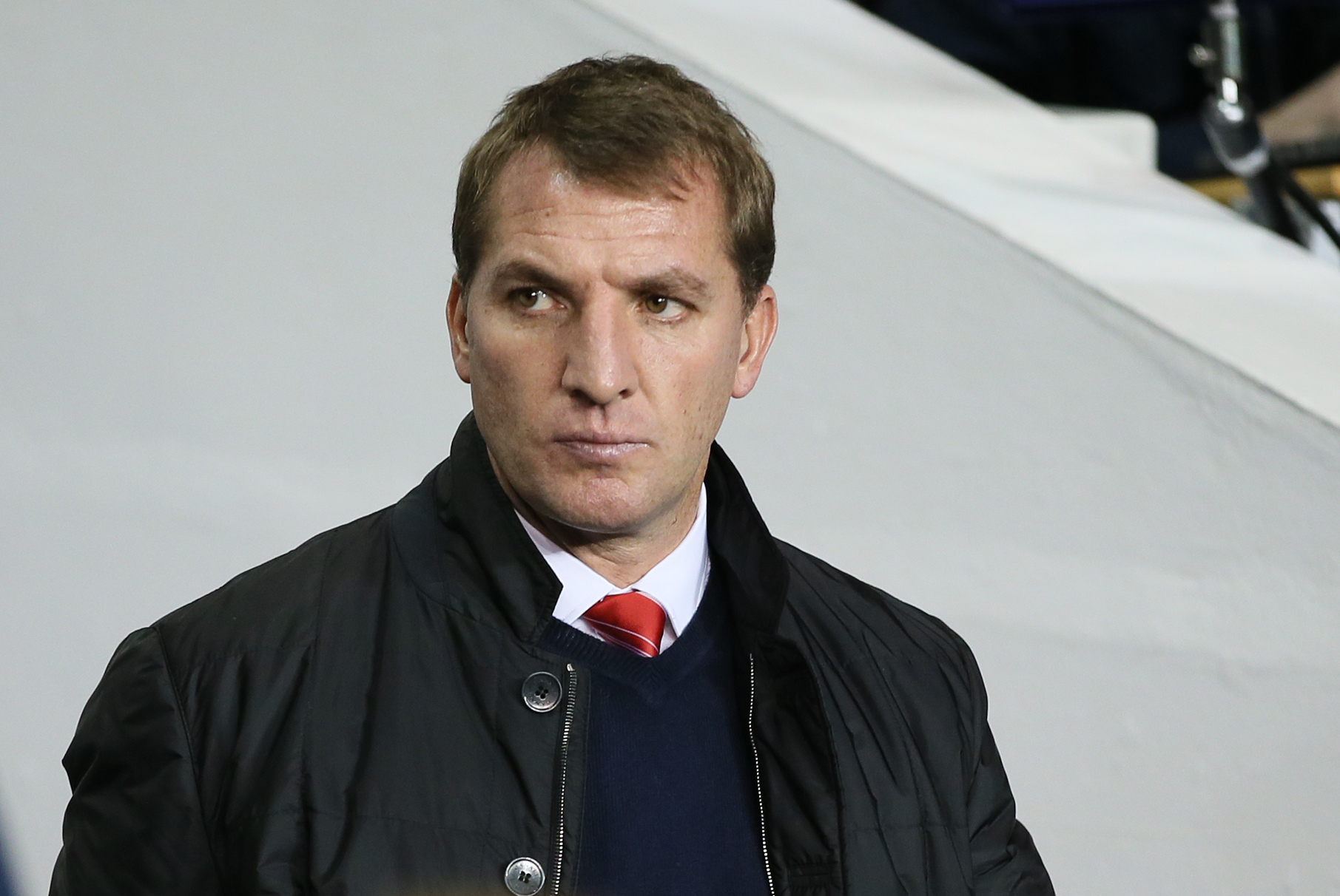 Liverpool's manager Brendan Rodgers walks to the technical area prior to kick off for their English Premier League soccer match between Tottenham Hotspur and Liverpool at the White Hart Lane stadium in London, Sunday, Dec.15, 2013. (AP Photo/Alastair Grant)