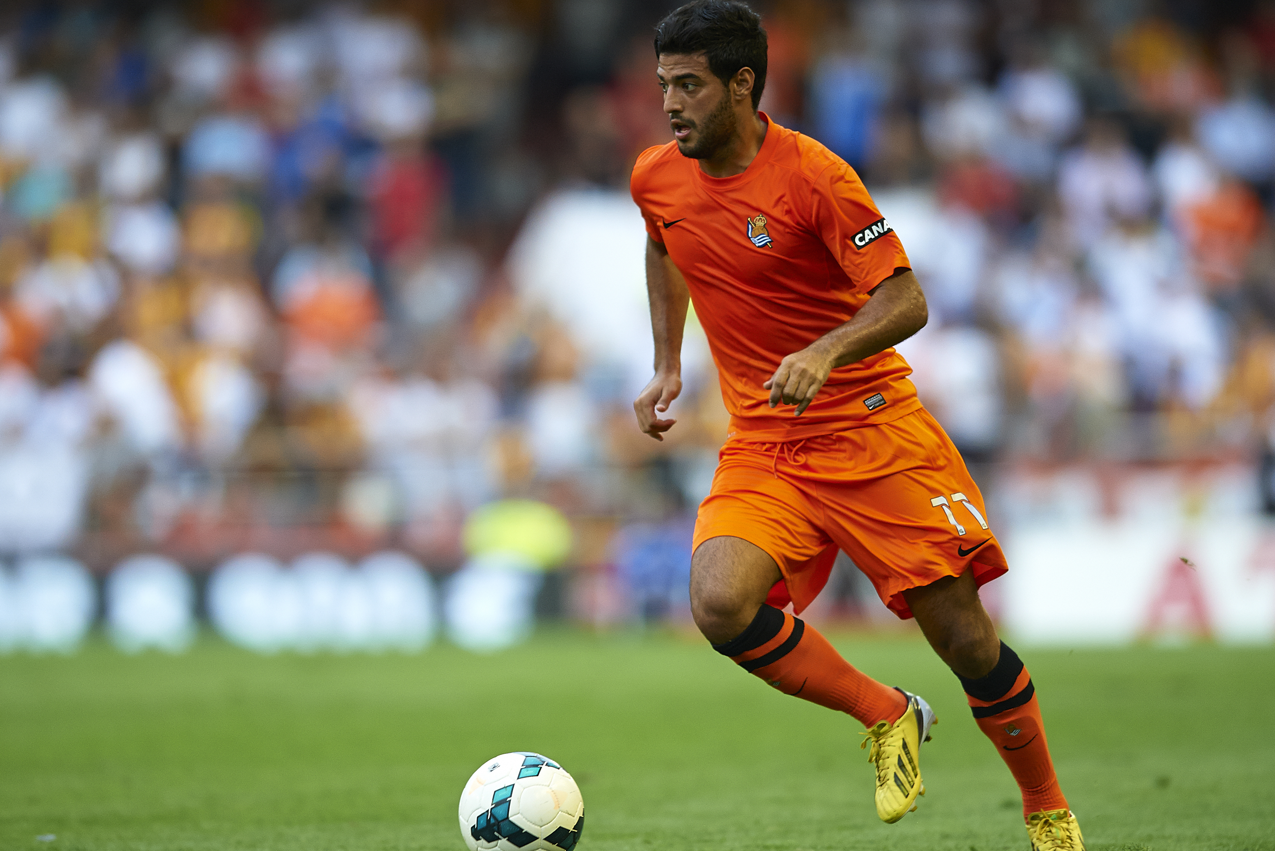 VALENCIA, SPAIN - OCTOBER 19:  Carlos Vela of Real Sociedad runs with the ball during the La Liga match between Valencia CF and Real Sociedad at Estadio Mestalla on October 19, 2013 in Valencia, Spain.  (Photo by Manuel Queimadelos Alonso/Getty Images)