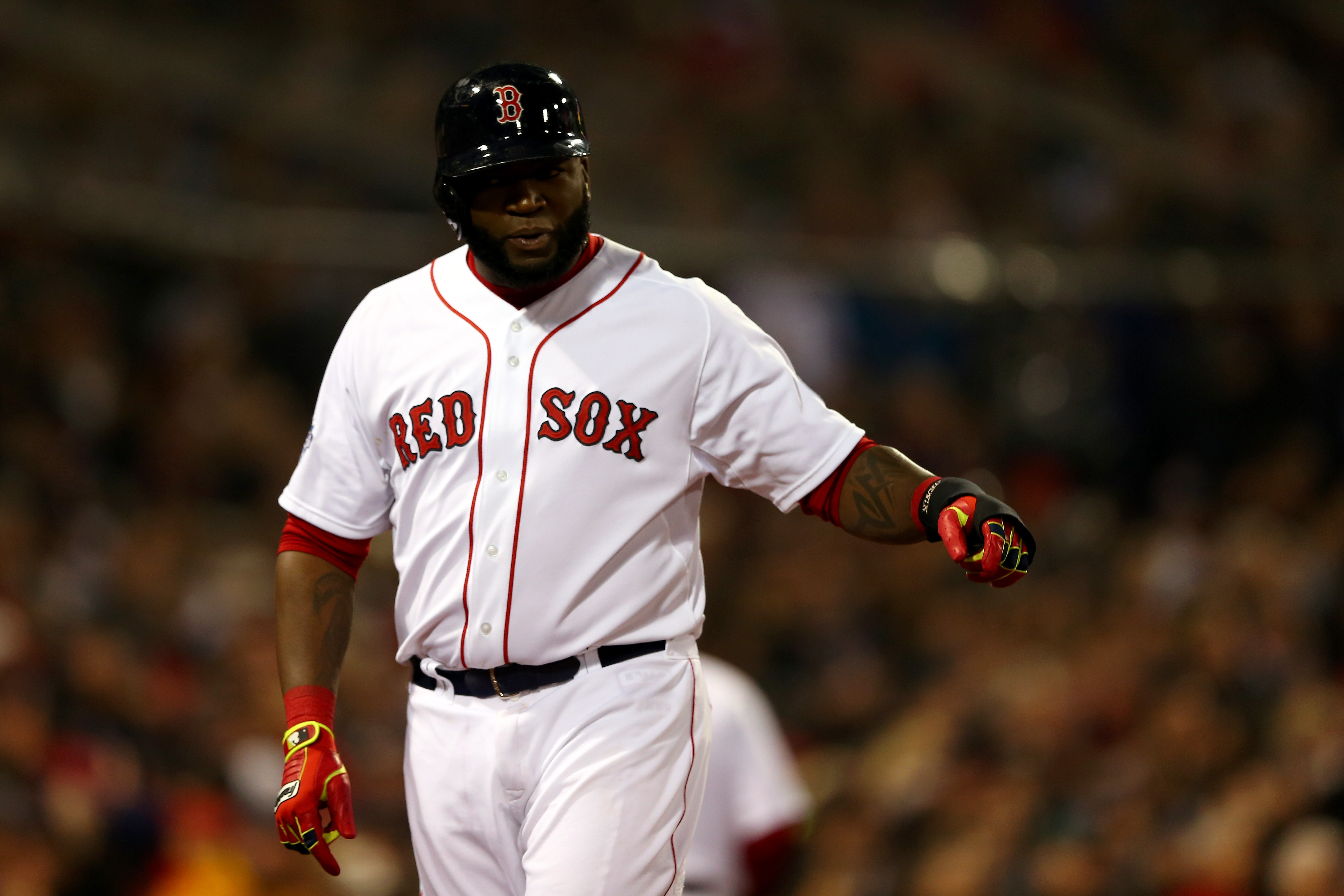 BOSTON, MA - OCTOBER 30:  David Ortiz #34 of the Boston Red Sox celebrates after scoring in the third inning against the St. Louis Cardinals during Game Six of the 2013 World Series at Fenway Park on October 30, 2013 in Boston, Massachusetts.  (Photo by Elsa/Getty Images)