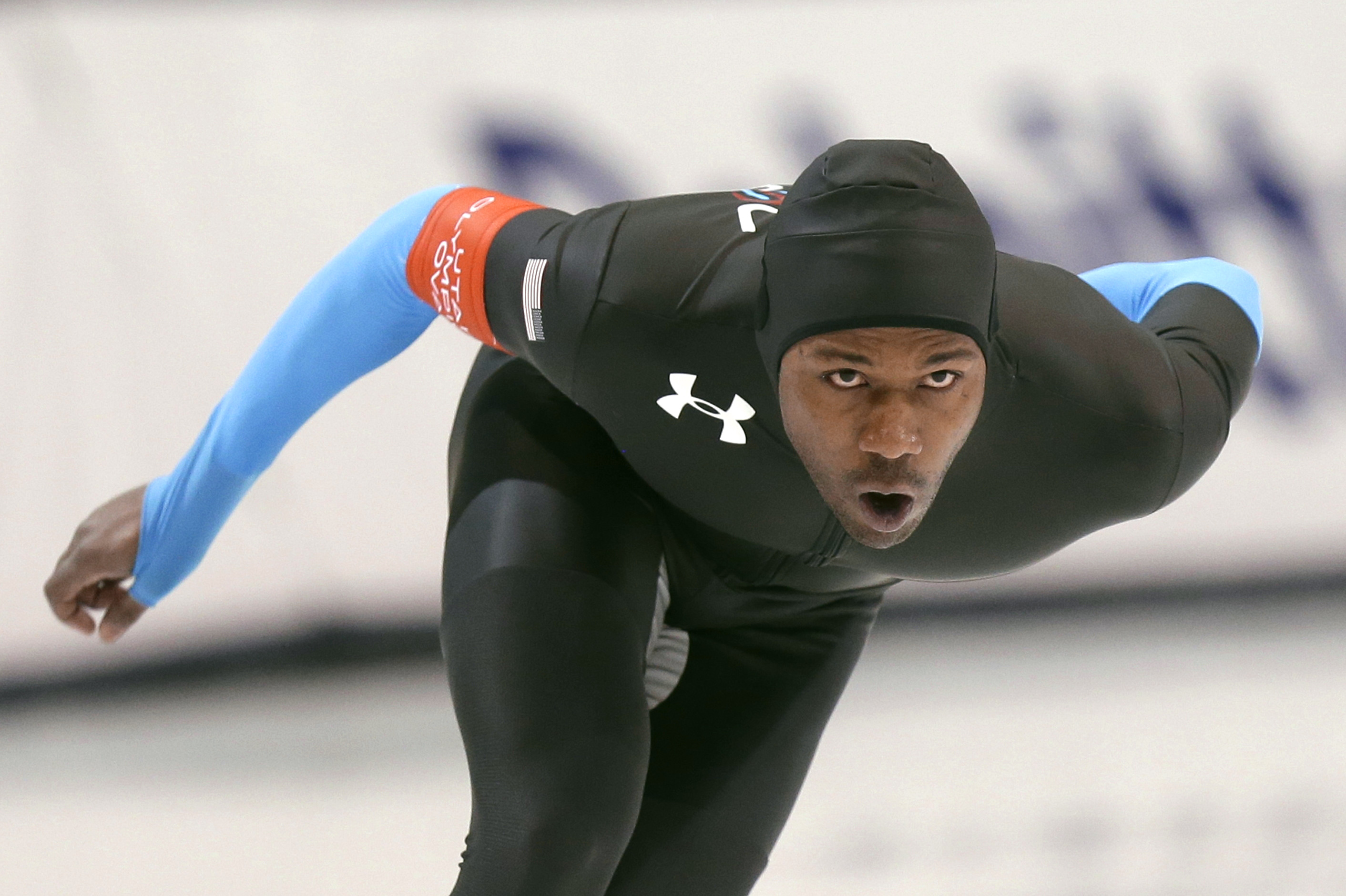 Shani Davis competes in the men's 1,500 meters, which he won, during the U.S. Olympic speedskating trials Tuesday, Dec. 31, 2013, in Kearns, Utah. (AP Photo/Rick Bowmer)