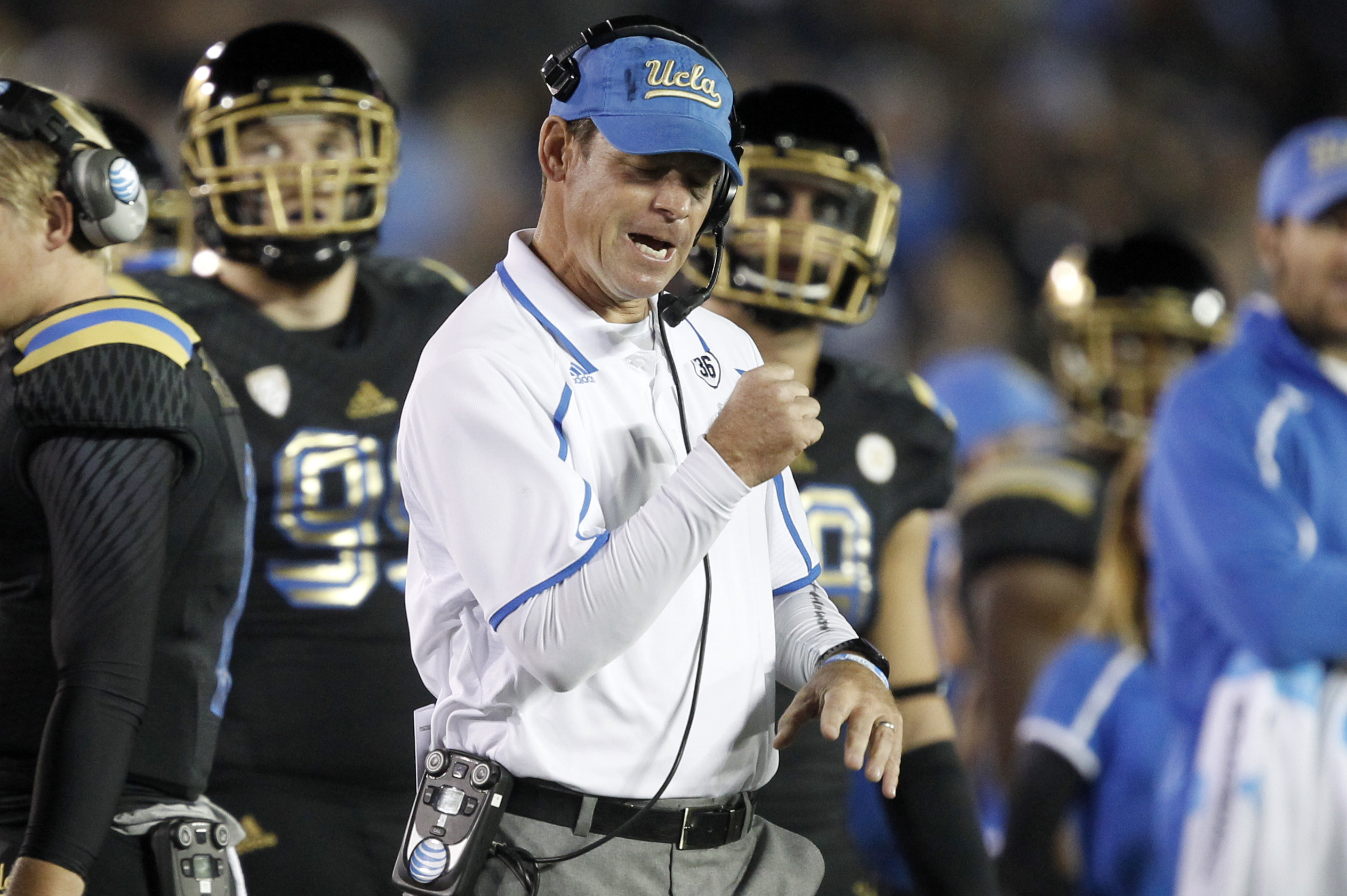 UCLA coach Jim Mora, center, reacts after his team recovered a fumble in the first quarter of an NCAA college football game against Washington, Friday, Nov. 15, 2013, in Pasadena, Calif. (AP Photo/Alex Gallardo)