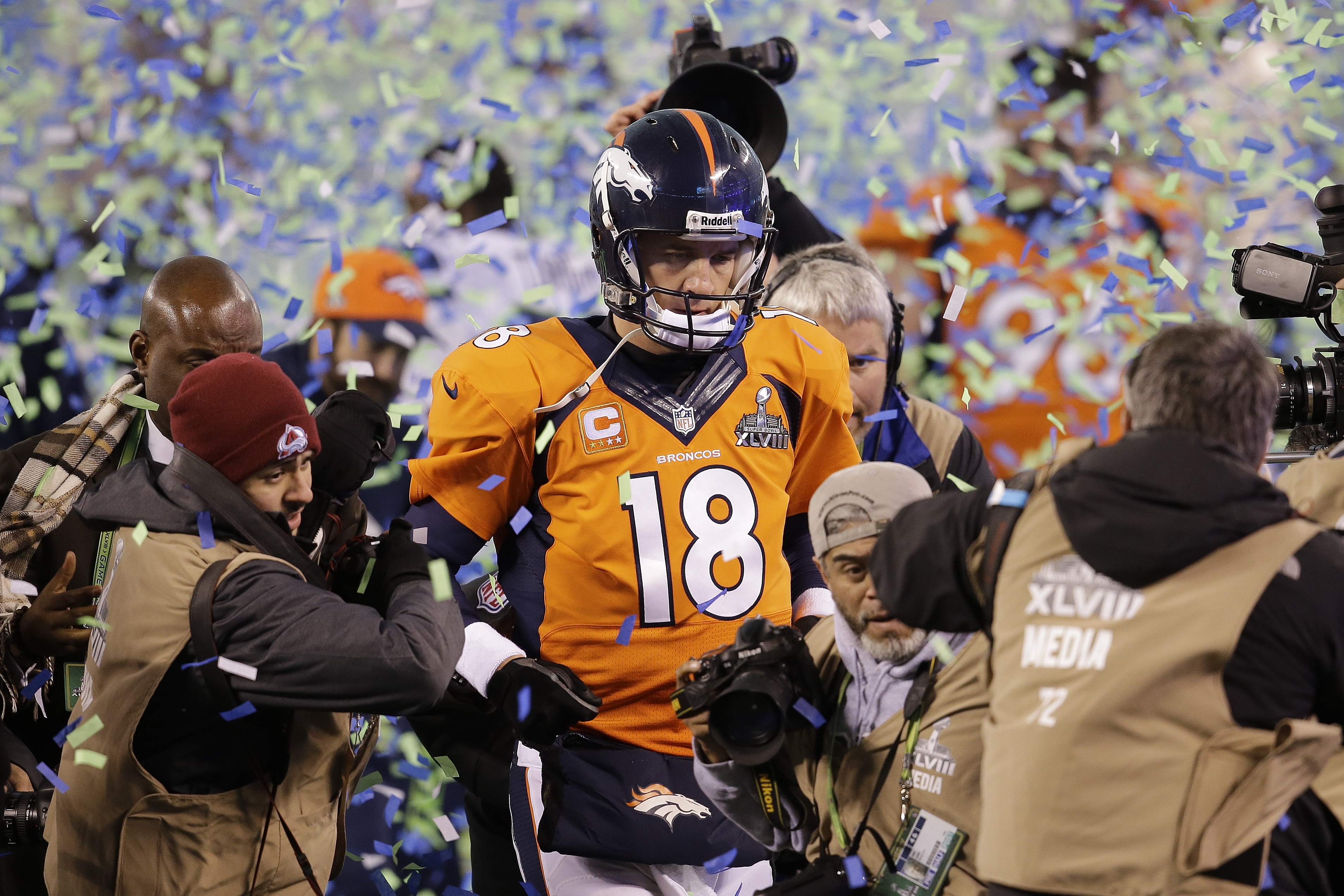 Denver Broncos quarterback Peyton Manning walks off the field after the Broncos lost to the Seattle Seahawks in the NFL Super Bowl XLVIII football game Sunday, Feb. 2, 2014, in East Rutherford, N.J. The Seahawks won 43-8. (AP Photo/Chris O'Meara)