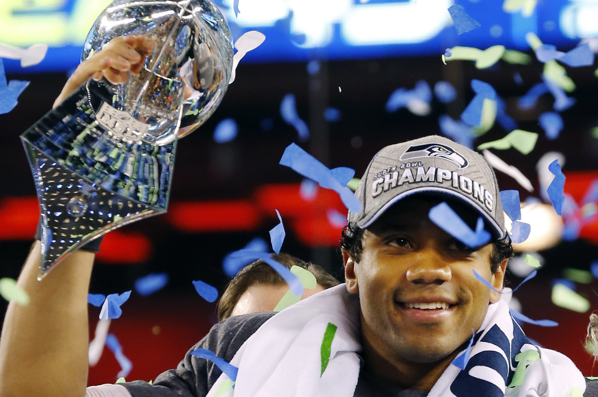 Seattle Seahawks' Russell Wilson holds the the Vince Lombardi Trophy after the NFL Super Bowl XLVIII football game Sunday, Feb. 2, 2014, in East Rutherford, N.J. The Seahawks won 43-8. (AP Photo/Paul Sancya)