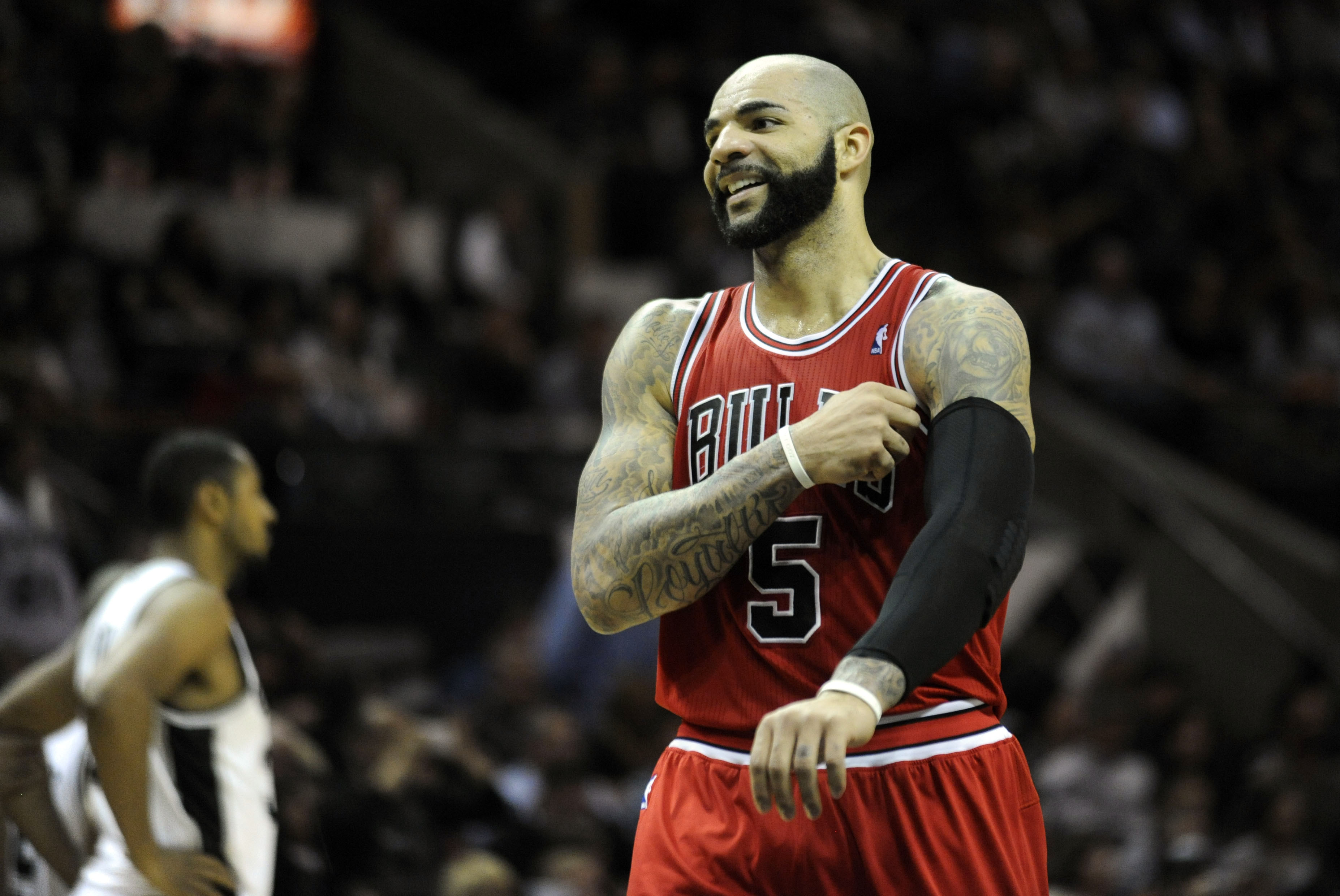 Jan 29, 2014; San Antonio, TX, USA; Chicago Bulls forward Carlos Boozer (5) reacts against the San Antonio Spurs during the second half at the AT&T Center. Chicago beat San Antonio 96-86. Mandatory Credit: Brendan Maloney-USA TODAY Sports