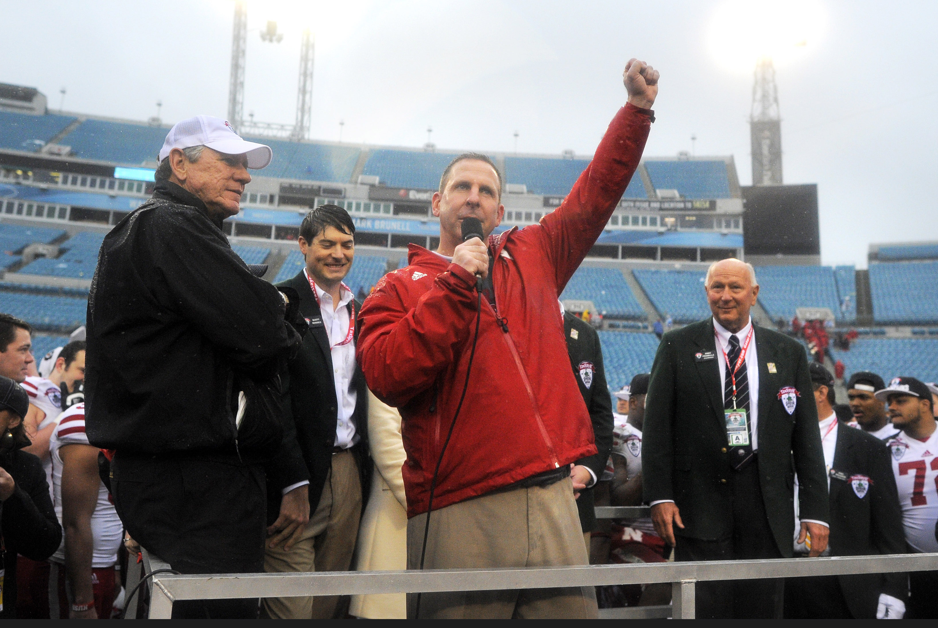 Nebraska head coach Bo Pelini celebrates on the riser after their 24-19 win over Georgia in the Gator Bowl NCAA college football game, Wednesday, Jan. 1, 2014, in Jacksonville, Fla.  (AP Photo/Stephen B. Morton)