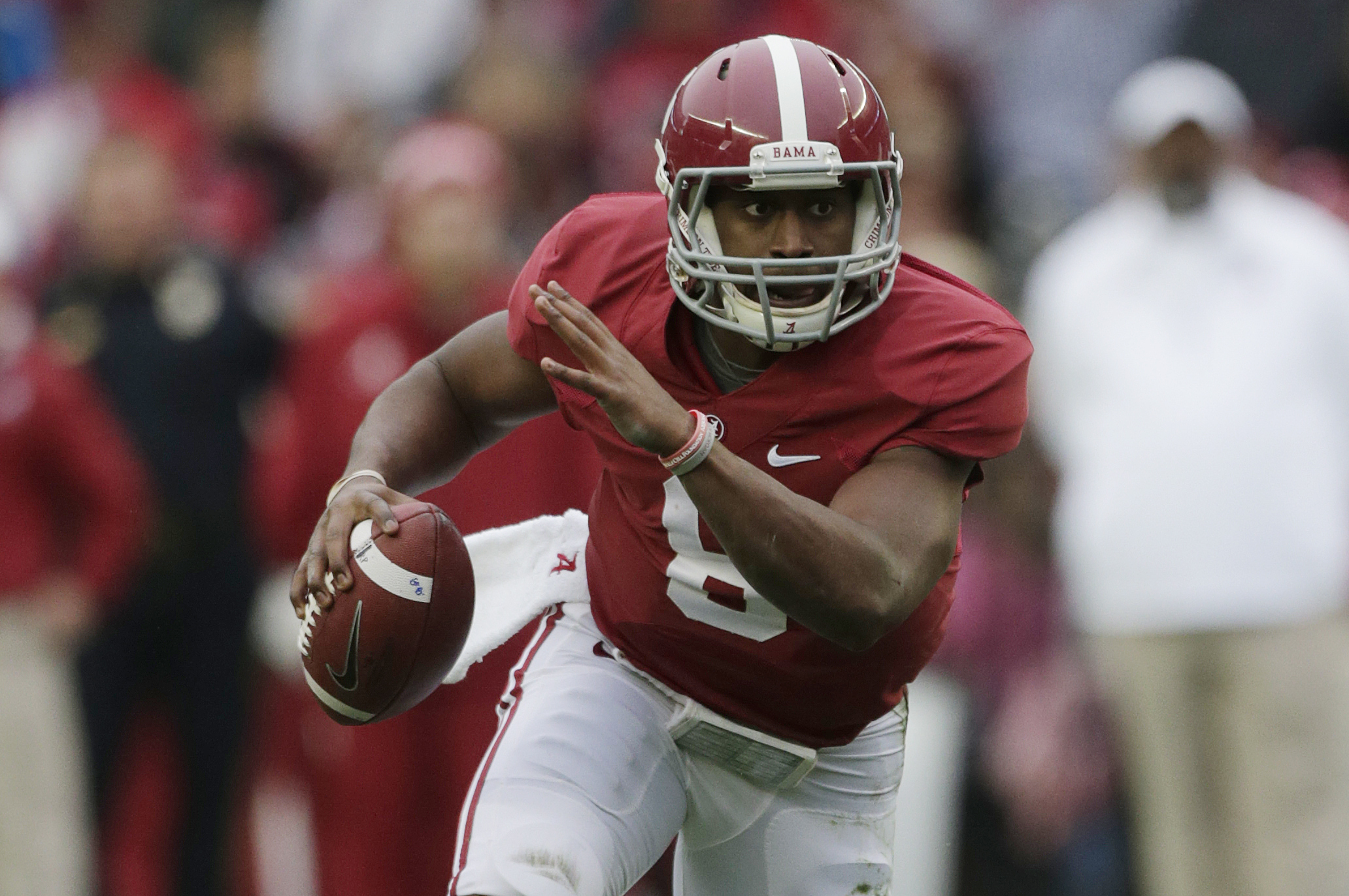 Alabama quarterback Blake Sims (6) looks for running room during the second half of an NCAA college football game against Chattanooga in Tuscaloosa, Ala., Saturday, Nov. 23, 2013. (AP Photo/Dave Martin)