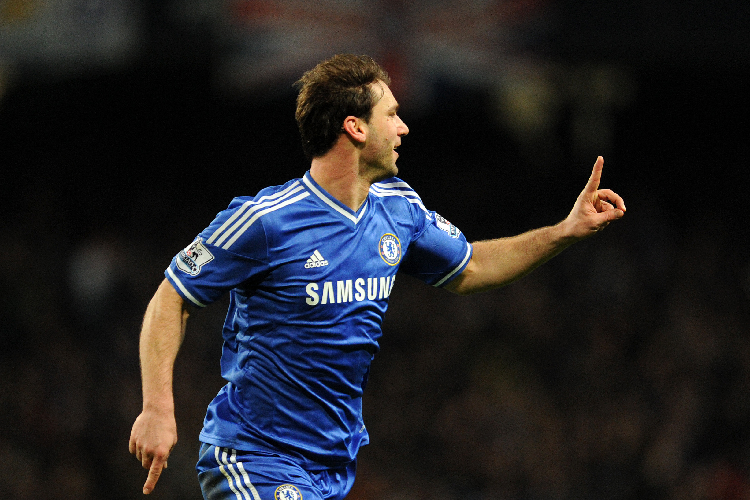 Chelsea's Branislav Ivanovic celebrates after he scores the first goal of the game for his side during their English Premier League soccer match against Manchester City at the Etihad stadium in Manchester, England, Monday Feb. 3, 2014. (AP Photo/Clint Hughes)