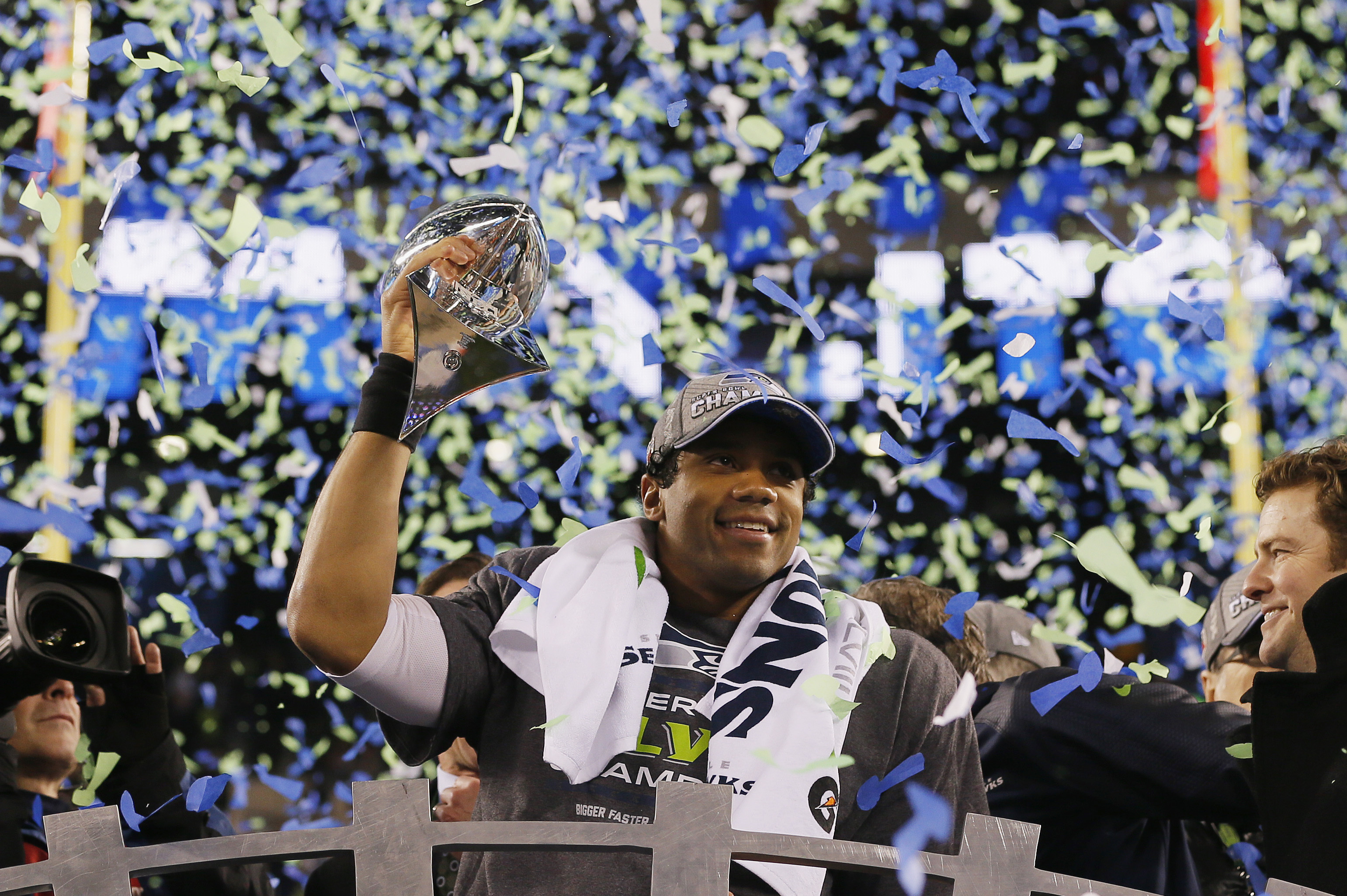 EAST RUTHERFORD, NJ - FEBRUARY 02:  Quarterback Russell Wilson #3 of the Seattle Seahawks celebrates with the Vince Lombardi Trophy after their 43-8 victory over the Denver Broncos during Super Bowl XLVIII at MetLife Stadium on February 2, 2014 in East Rutherford, New Jersey.  (Photo by Kevin C. Cox/Getty Images)