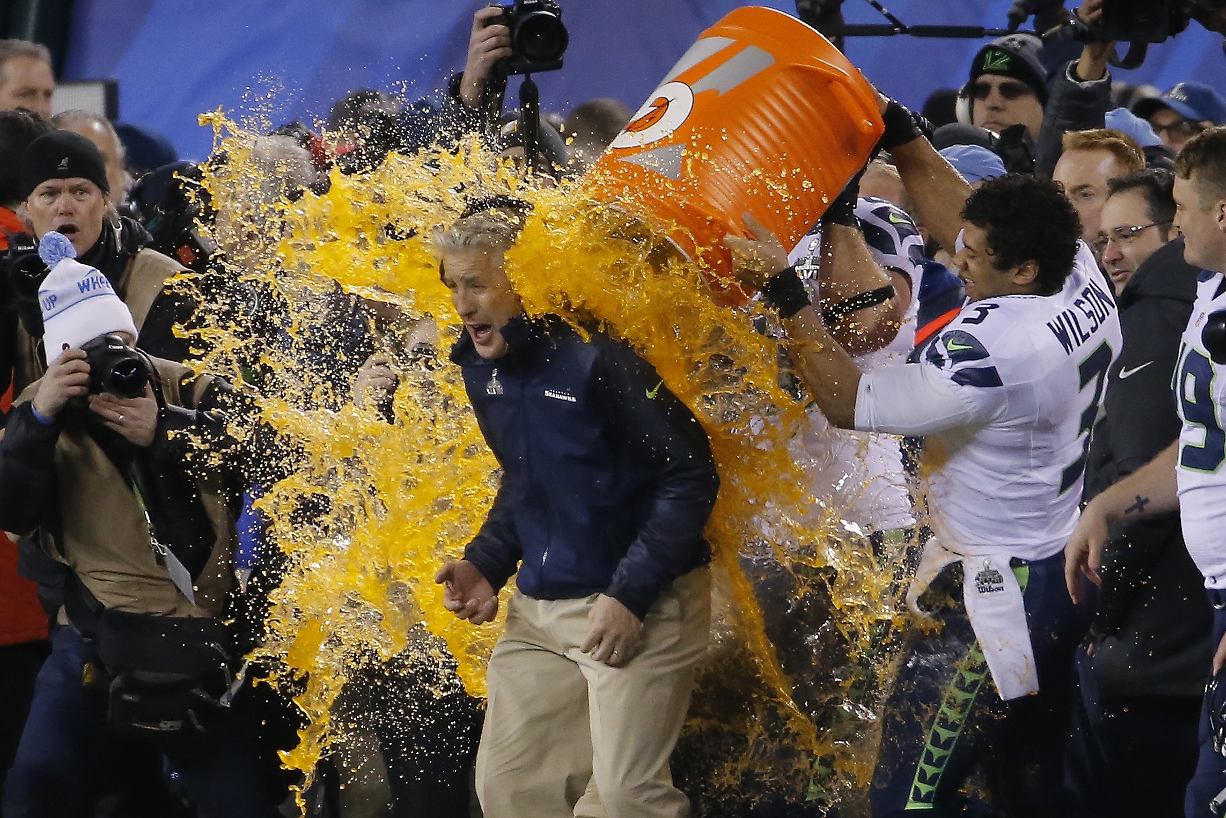 Seattle Seahawks quarterback Russell Wilson (3) dumps Gatorade on head coach Pete Carroll late in the game against the Denver Broncos during the second half of the NFL Super Bowl XLVIII football game Sunday, Feb. 2, 2014, in East Rutherford, N.J. Seattle won 43-8. (AP Photo/Matt York)