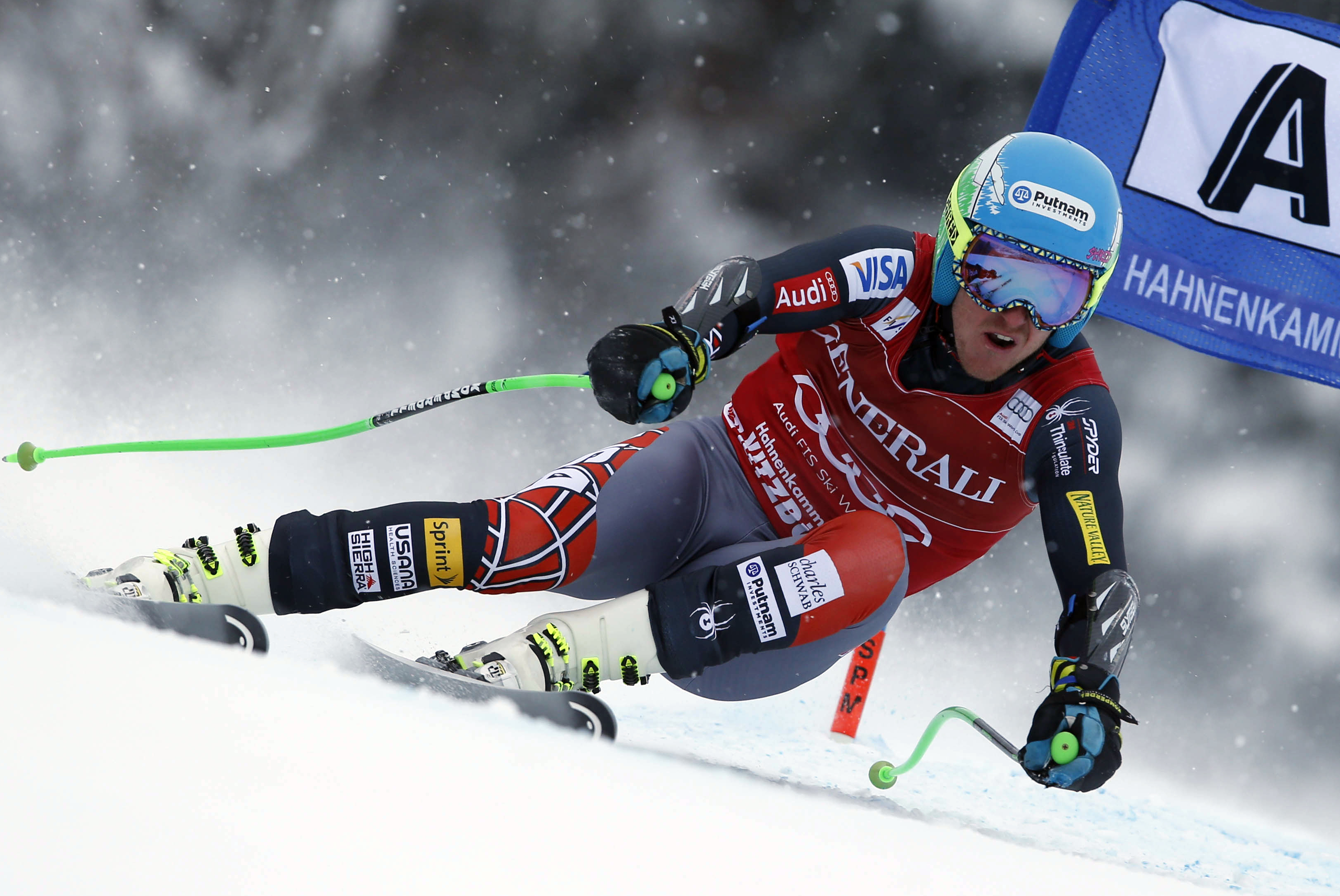 Ted Ligety, of the US, speeds down the slope on his way to take second place in an alpine ski men's World Cup super-combined, in Kitzbuehel, Austria, Sunday, Jan. 26, 2014. (AP Photo/Shinichiro Tanaka)
