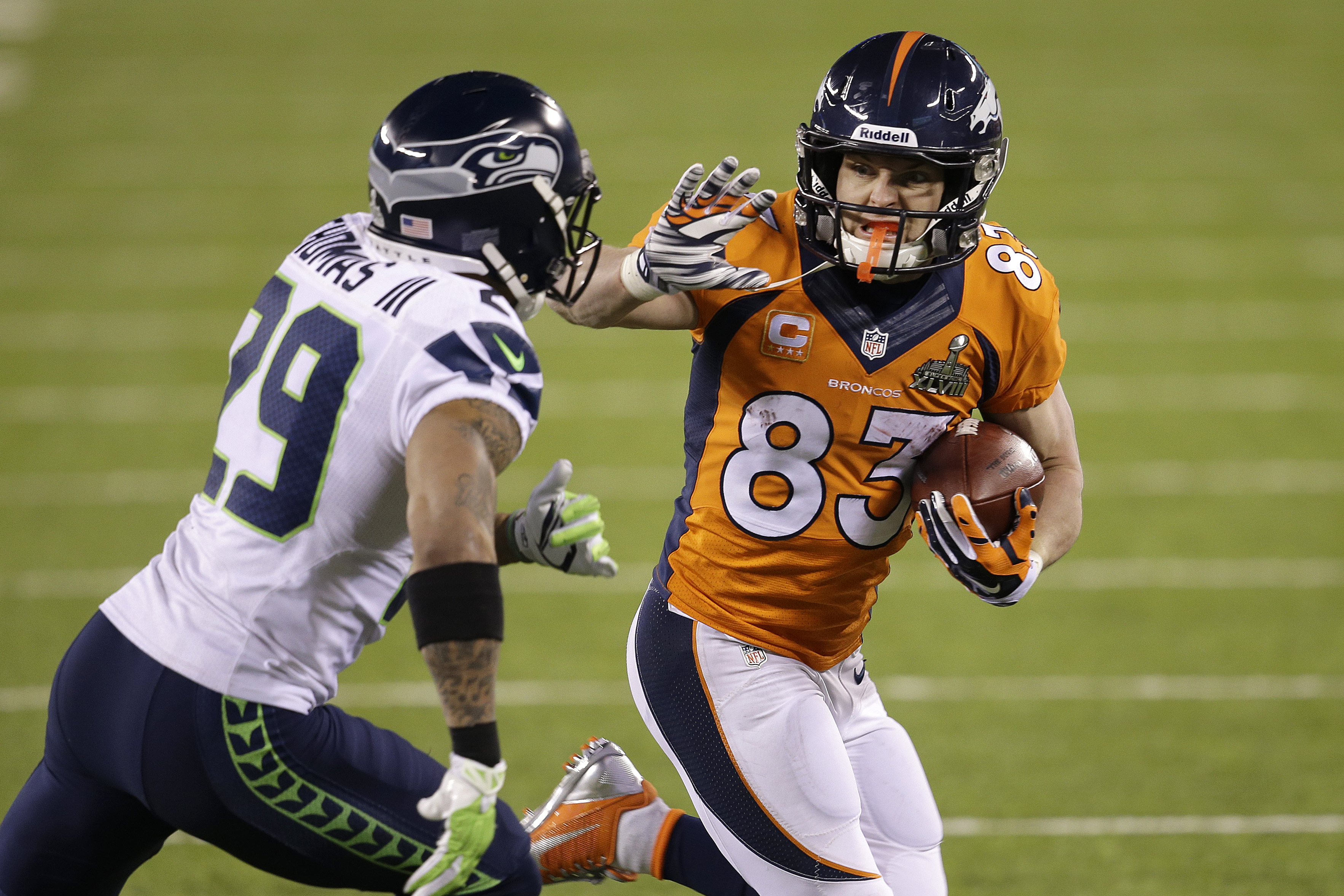 Denver Broncos' Wes Welker (83) runs against Seattle Seahawks' Earl Thomas during the second half of the NFL Super Bowl XLVIII football game Sunday, Feb. 2, 2014, in East Rutherford, N.J. (AP Photo/Chris O'Meara)